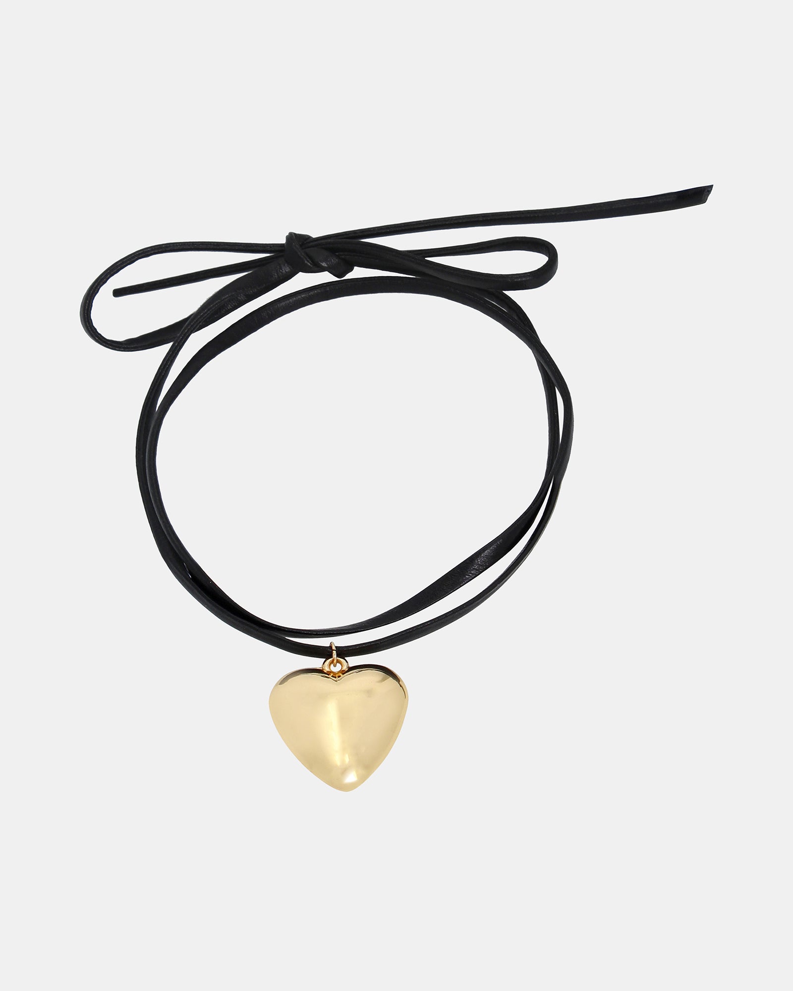 Front view of a gold heart necklace with a delicate chain