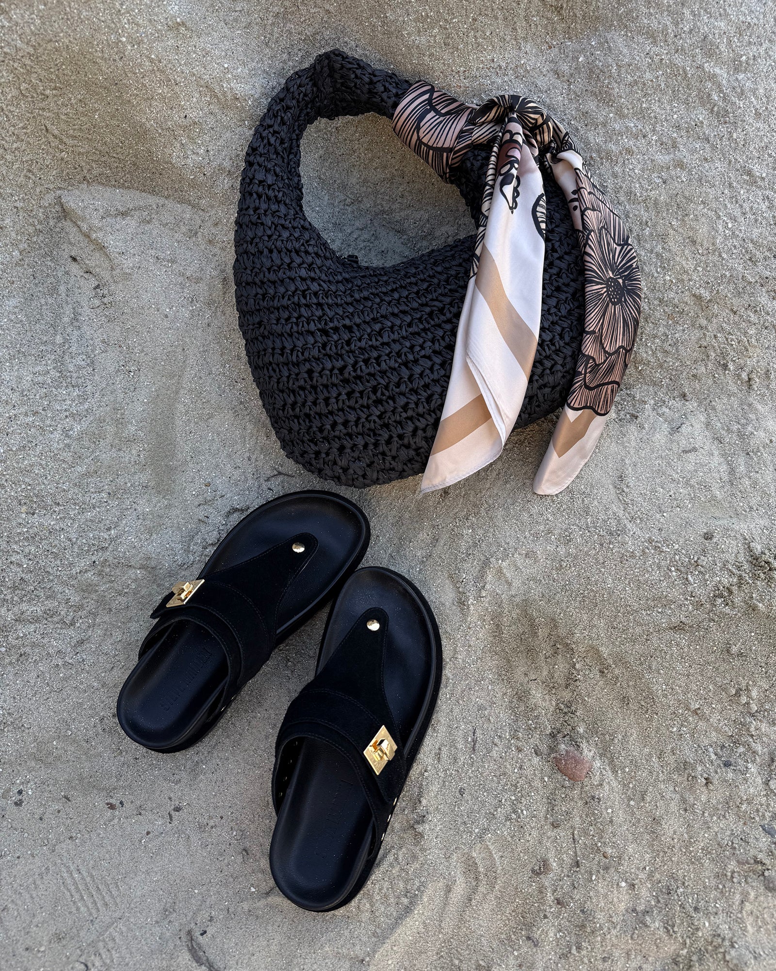 Stylish black suede thong sandals with 1.5-inch heel.