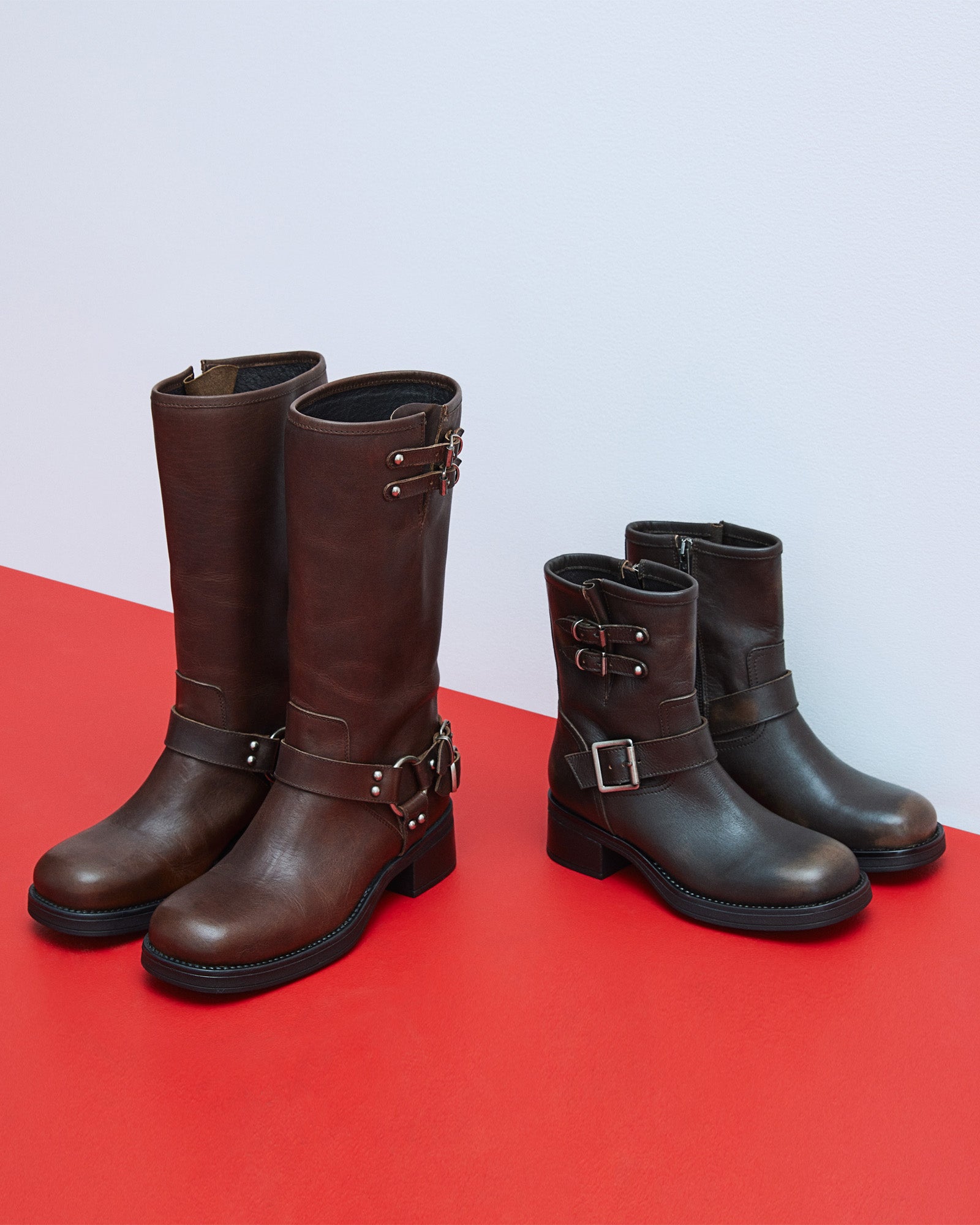 ASTOR brown leather boots side view showing buckle accents