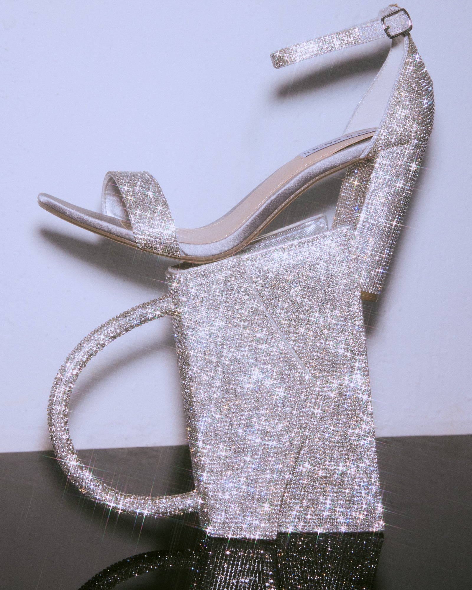 Black Carrson rhinestone heels angled view, showcasing crystal details