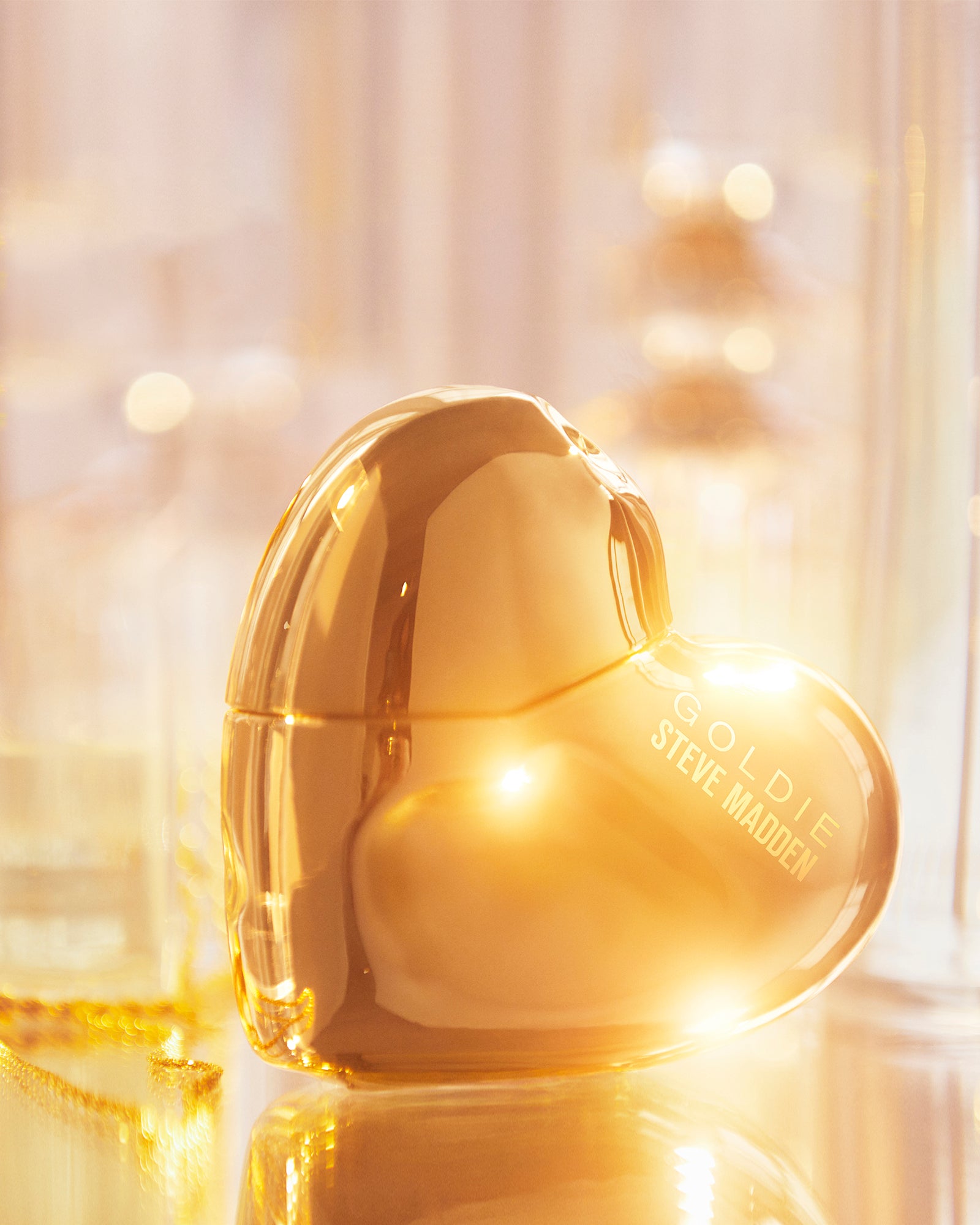 Goldie fragrance on a vanity, highlighting its vibrant floral essence.