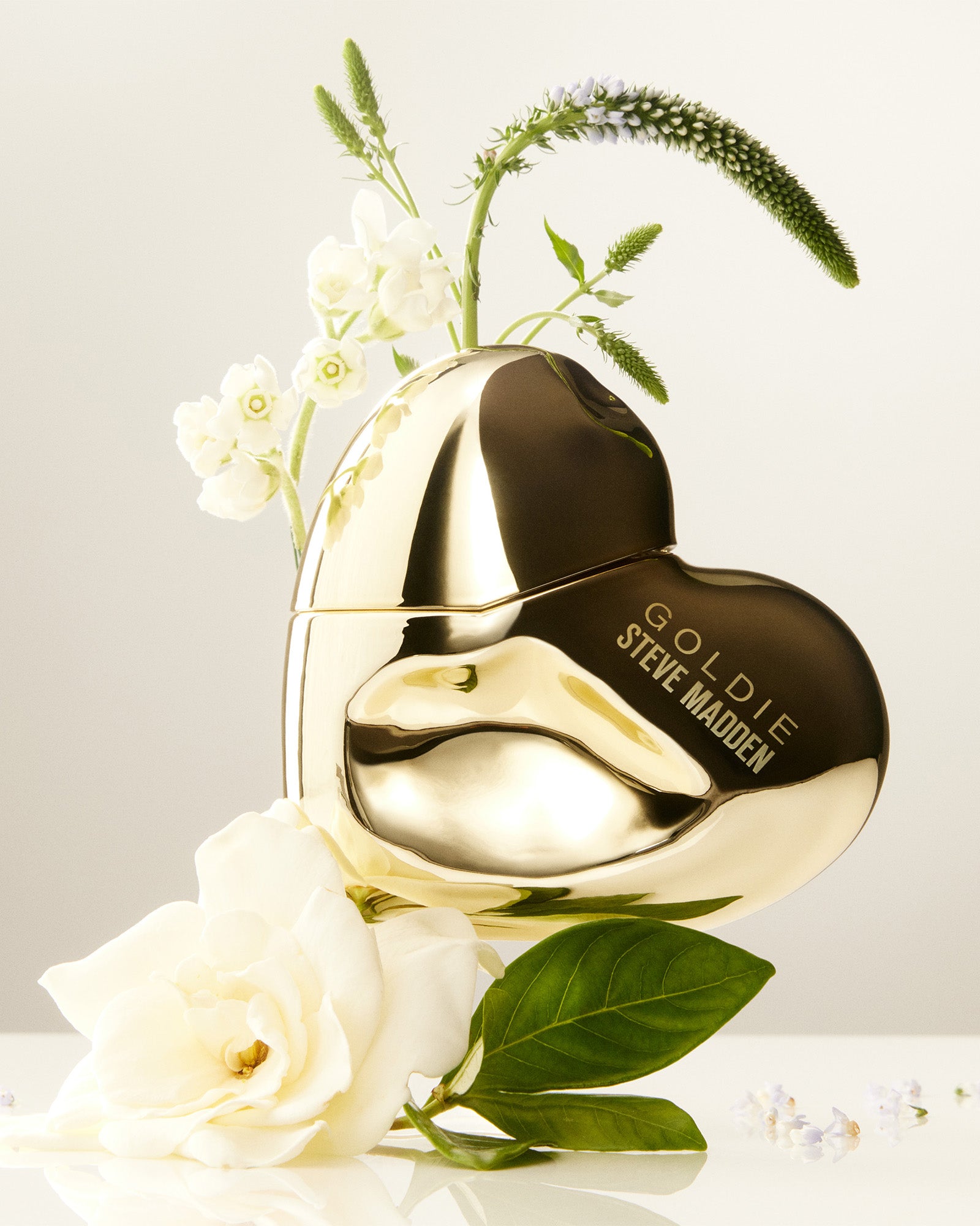 Close-up of Goldie perfume showcasing the elegant bottle design.