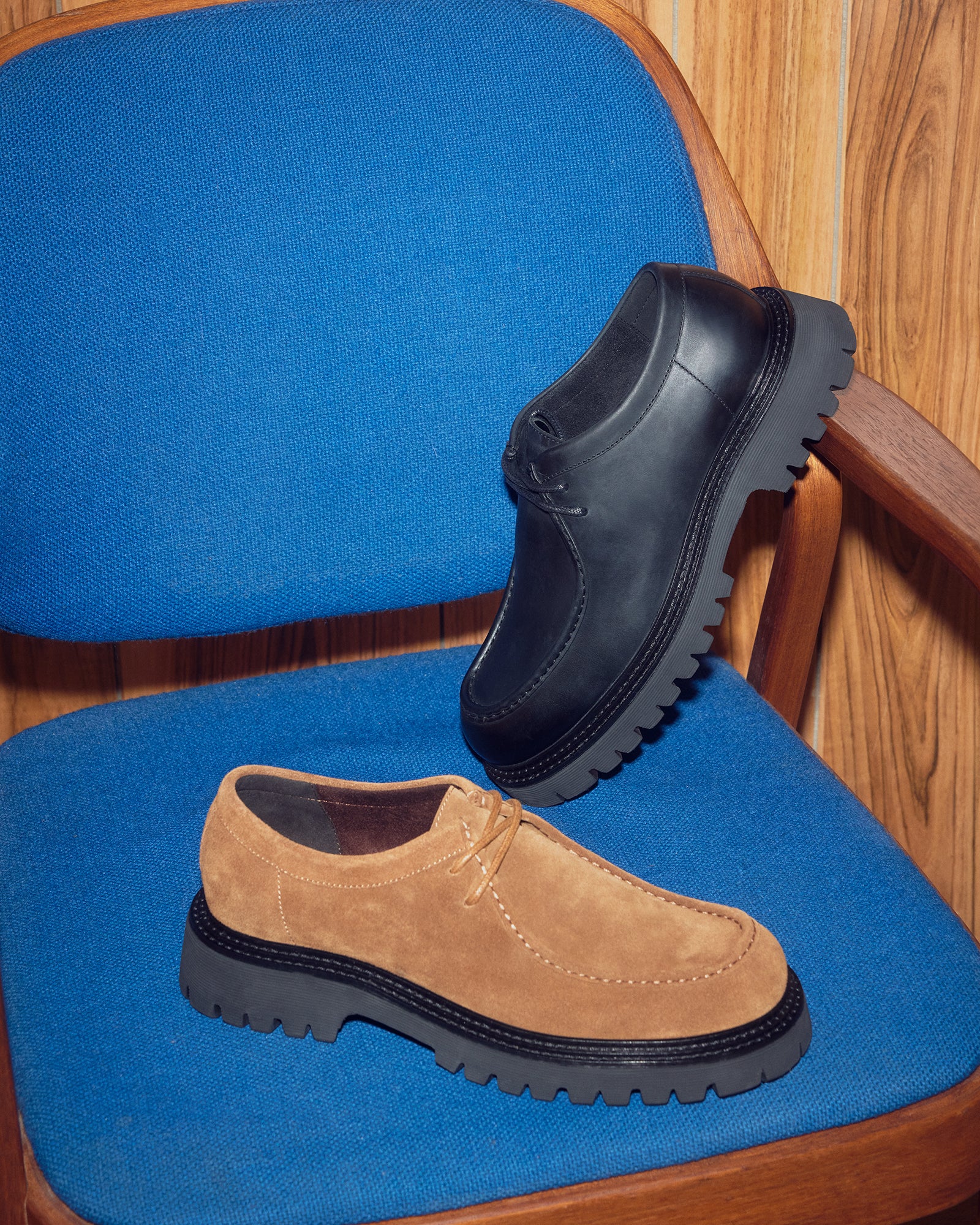 KALKIN mens black leather shoes showcased on a wooden bench for a rustic look.
