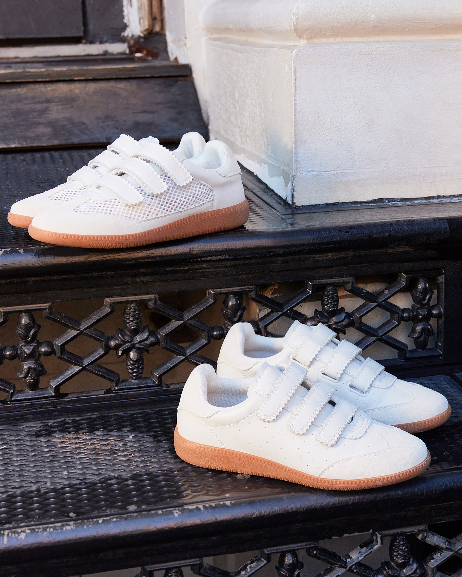 Side view of stylish white sneakers with Velcro closure for women