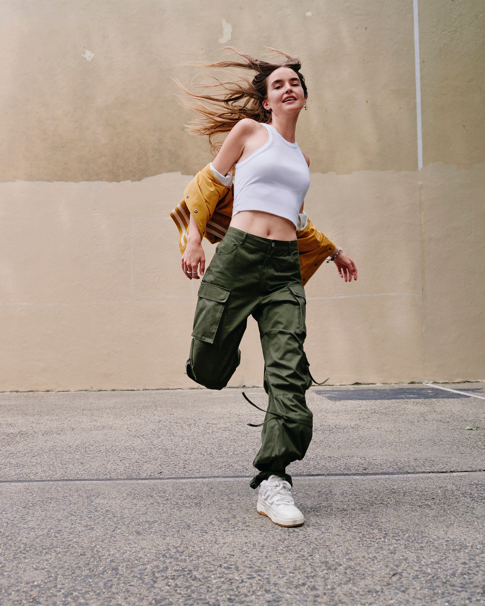 Side profile of model wearing wide leg linen pants with a relaxed fit