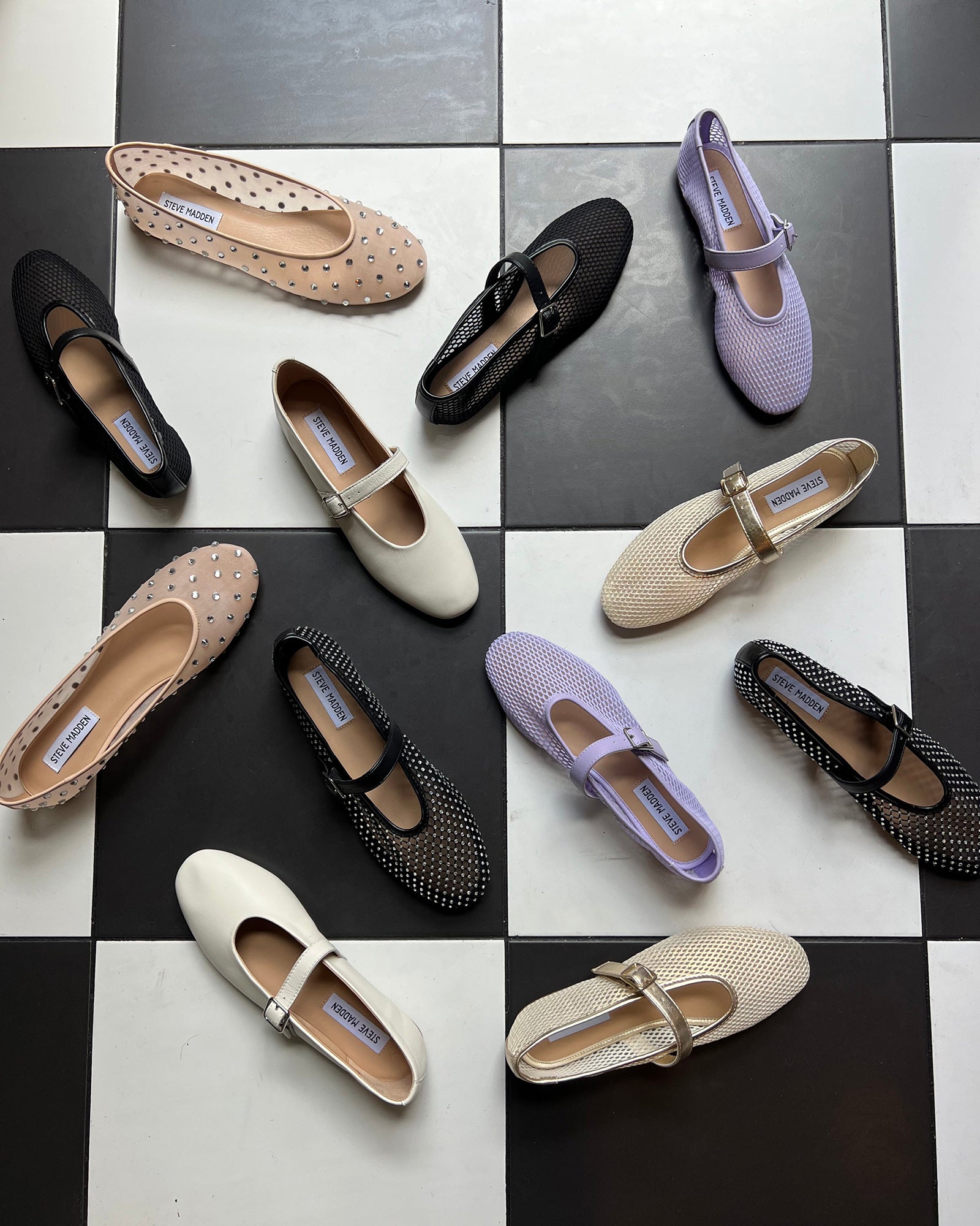 Close-up side view of black ballet flats showing mesh texture and slim silhouette