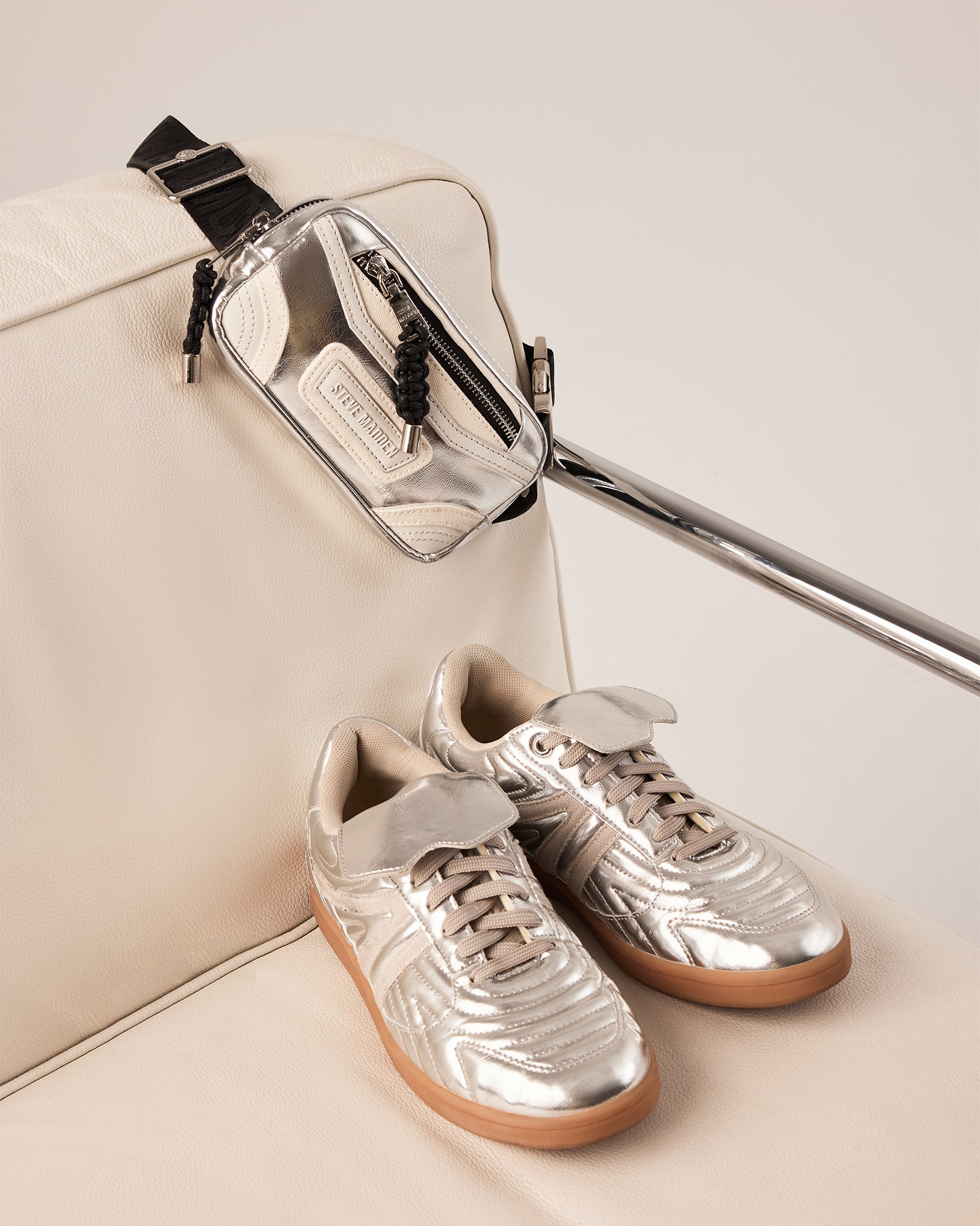 Madridd sporty belt bag in silver, showcasing adjustable strap and logo detail.