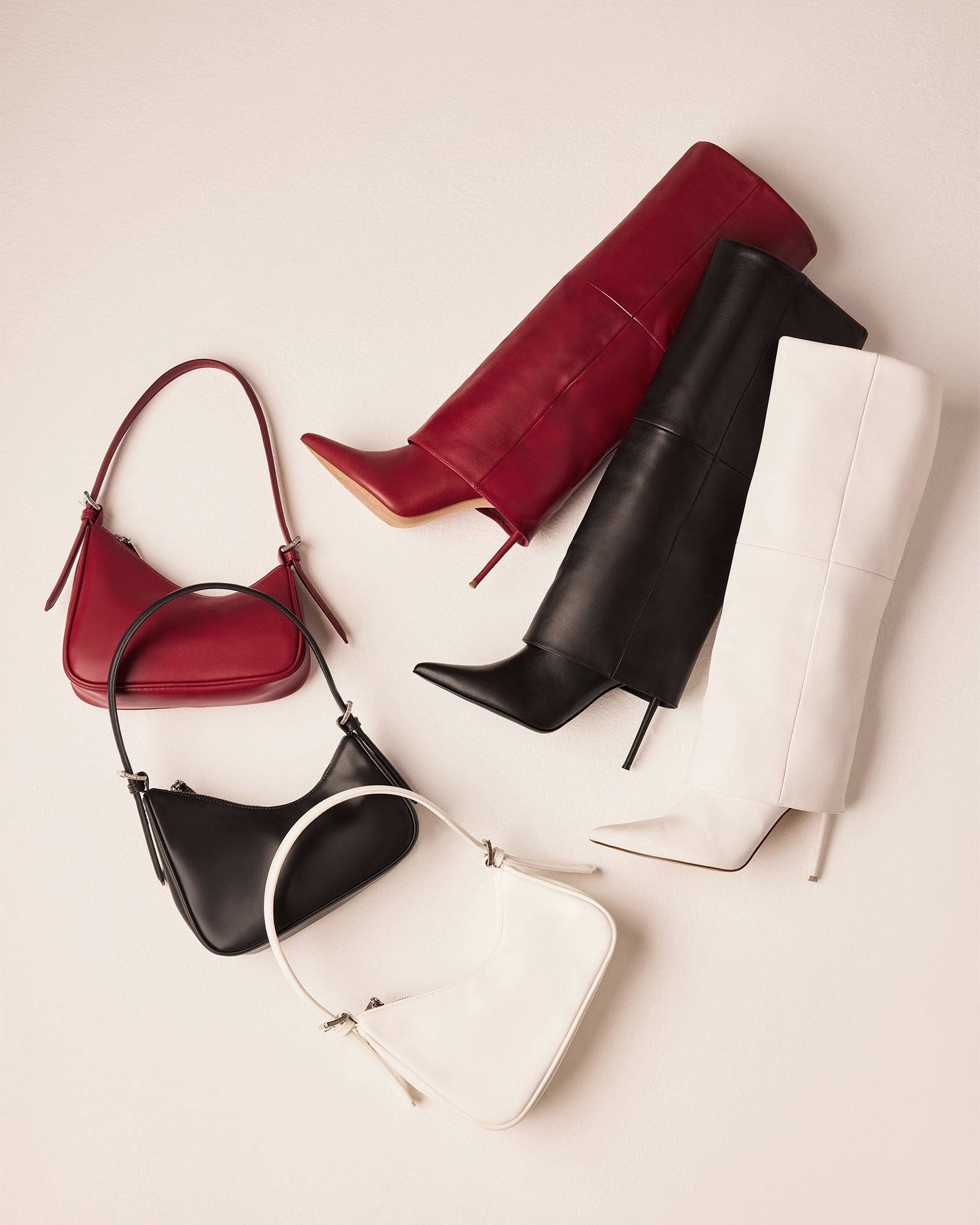 Side angle of the black leather shoulder bag with adjustable strap