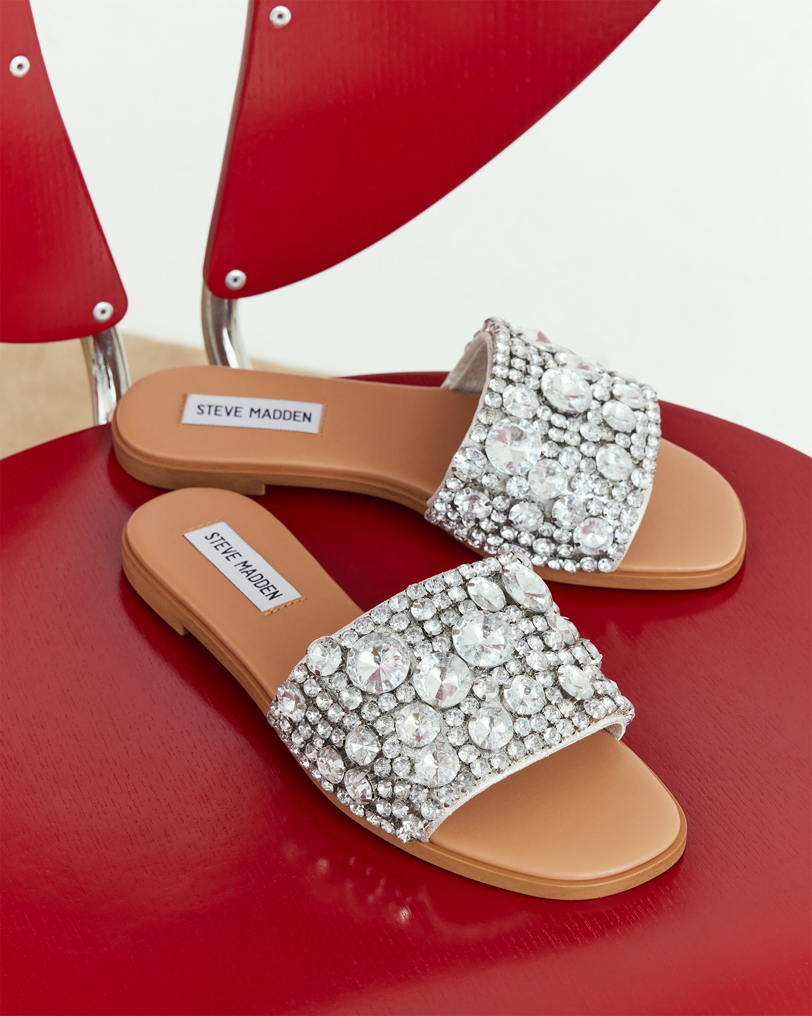 Woman wearing Knicky rhinestone flat sandals with casual summer outfit