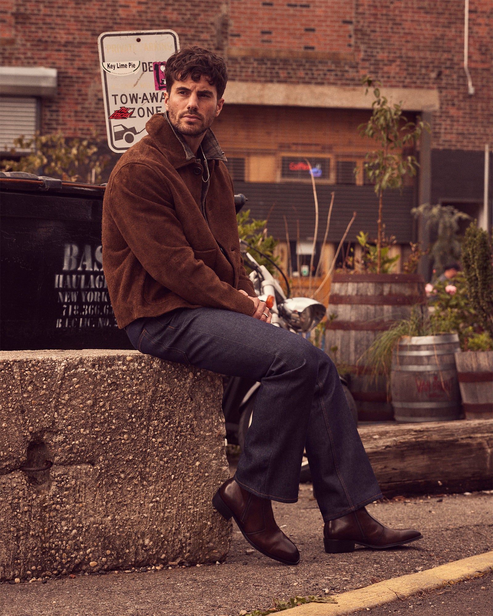 Side angle of brown leather ankle boots highlighting the block heel.