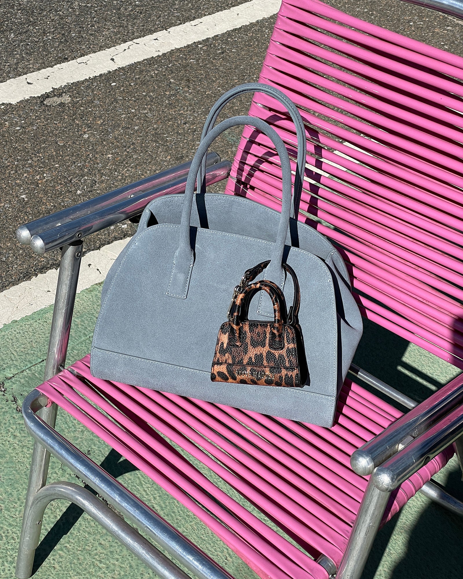 Close-up of the HADLEE tote bag showing its suede texture and gold hardware, perfect for everyday use