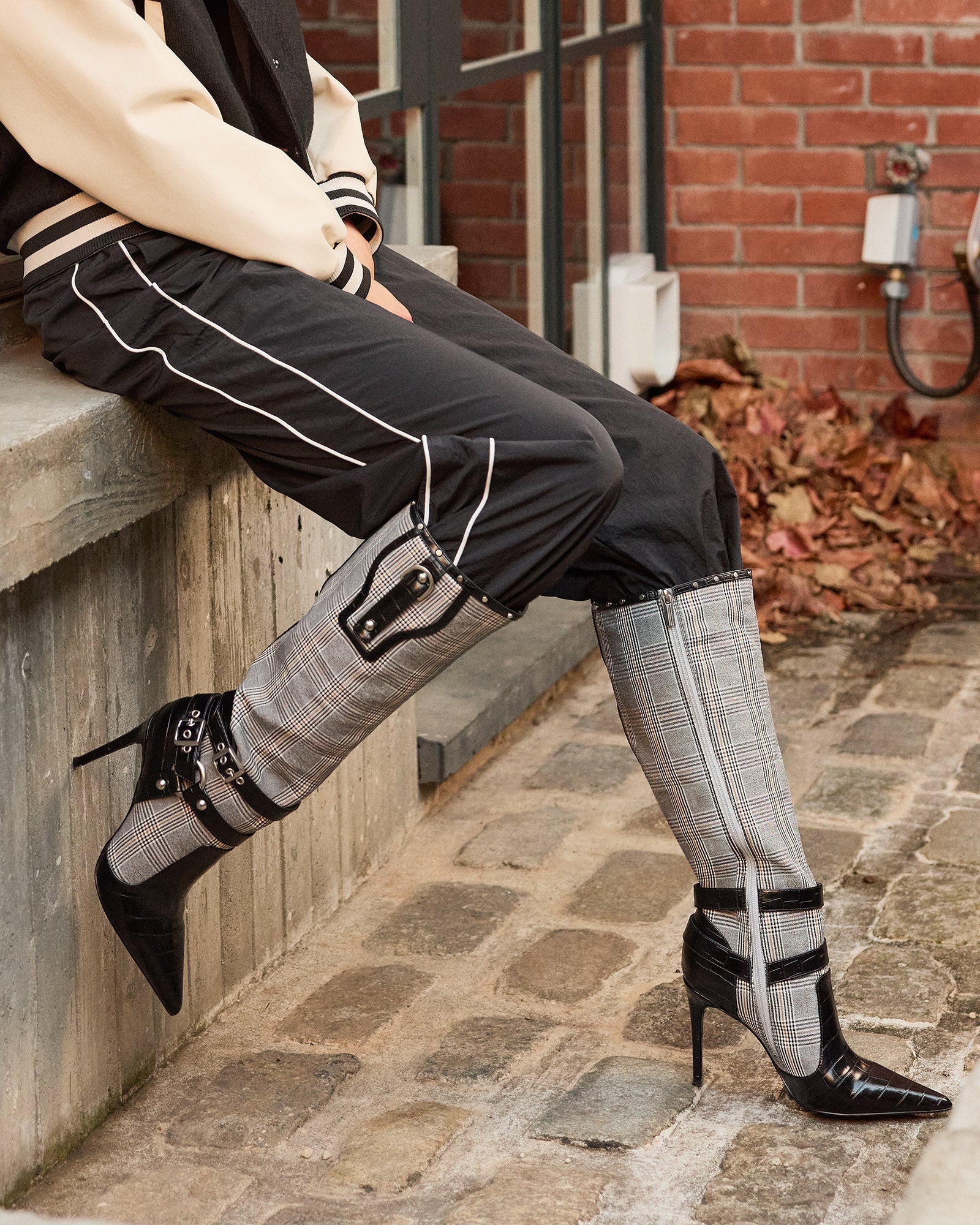 Close-up of shaft measurements and buckle design on knee-high boots