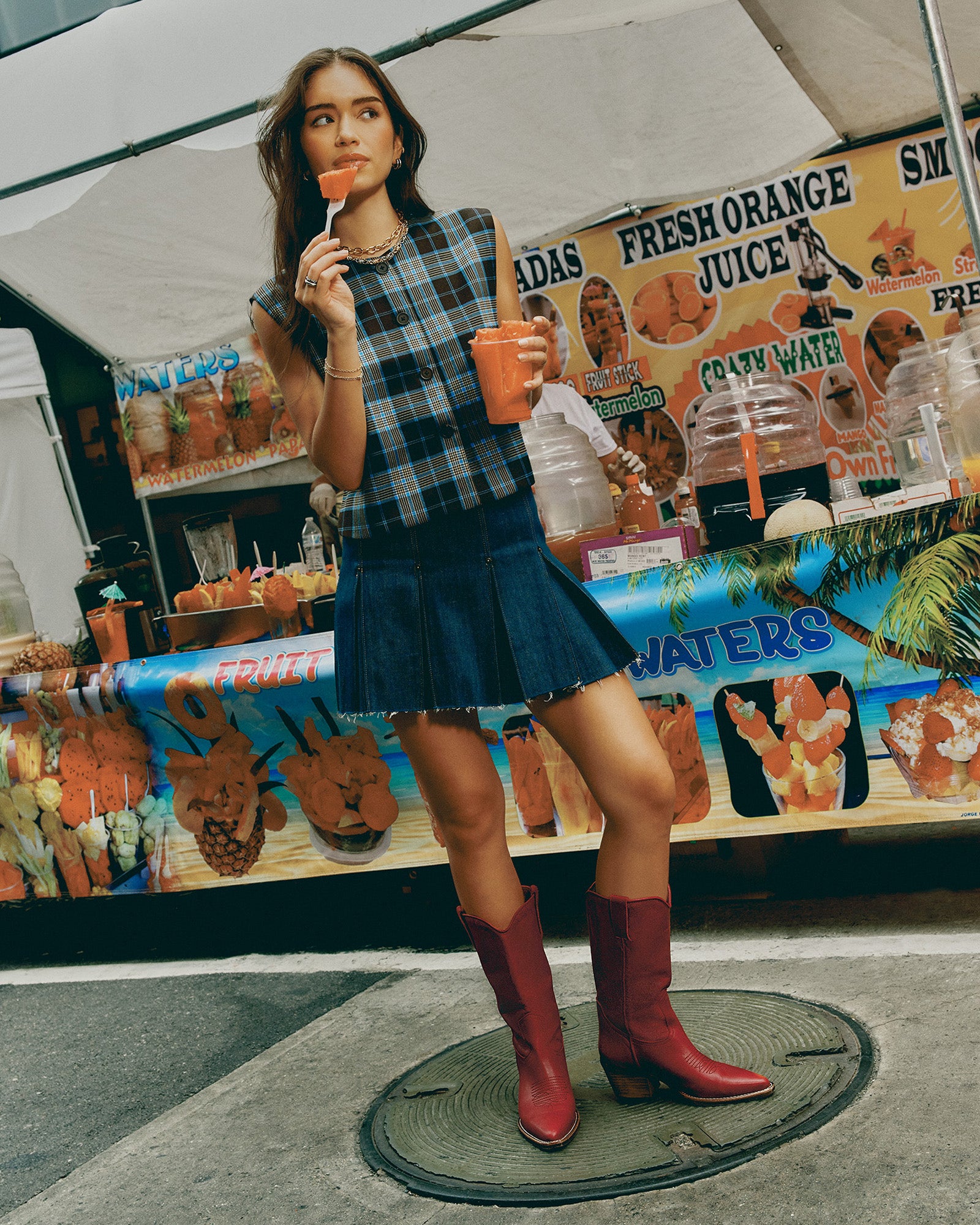 Side profile of model wearing the brown plaid blouse paired with denim — perfect for Detroit weekends