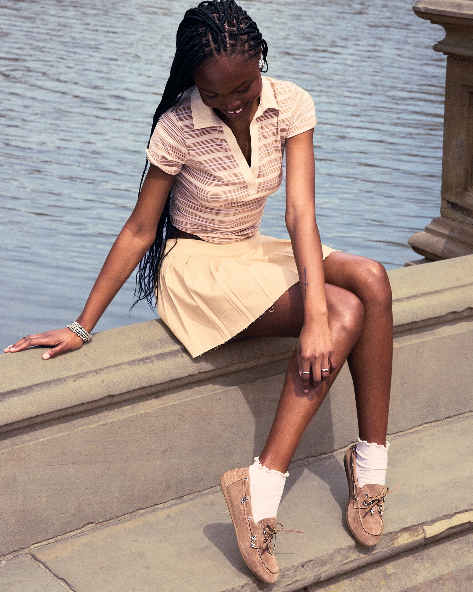 Pair of flat shoes styled with cropped denim and blazer