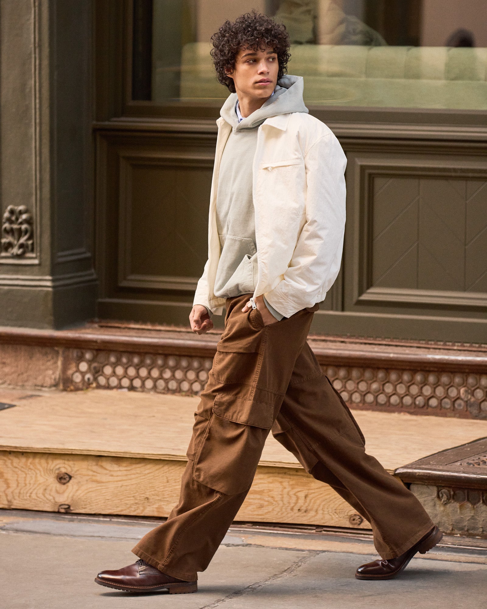 Brown lace up boots photographed outdoors on a stone path — ideal for fall outfits