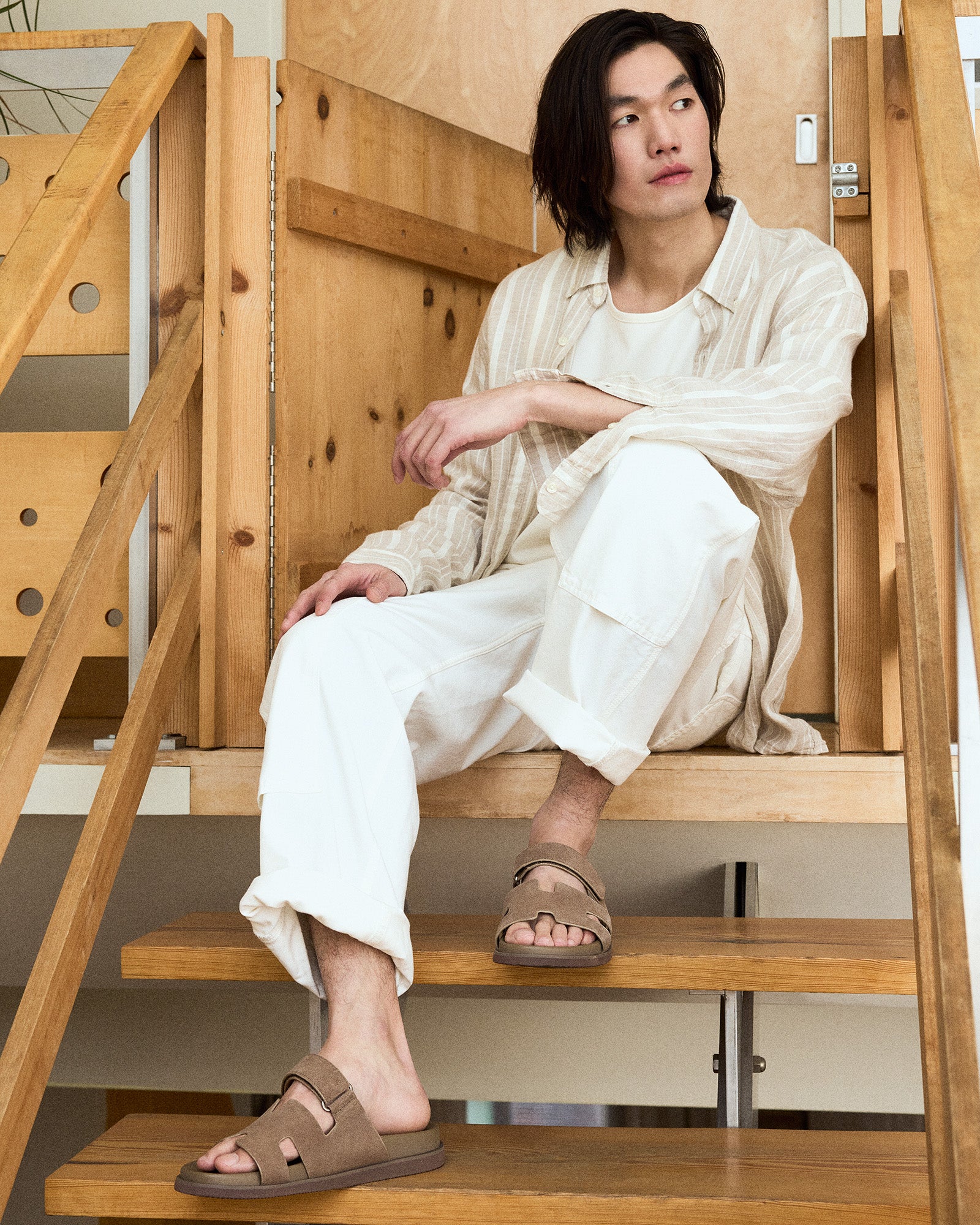 Close-up of taupe suede sandals showcasing the soft material and stylish design.