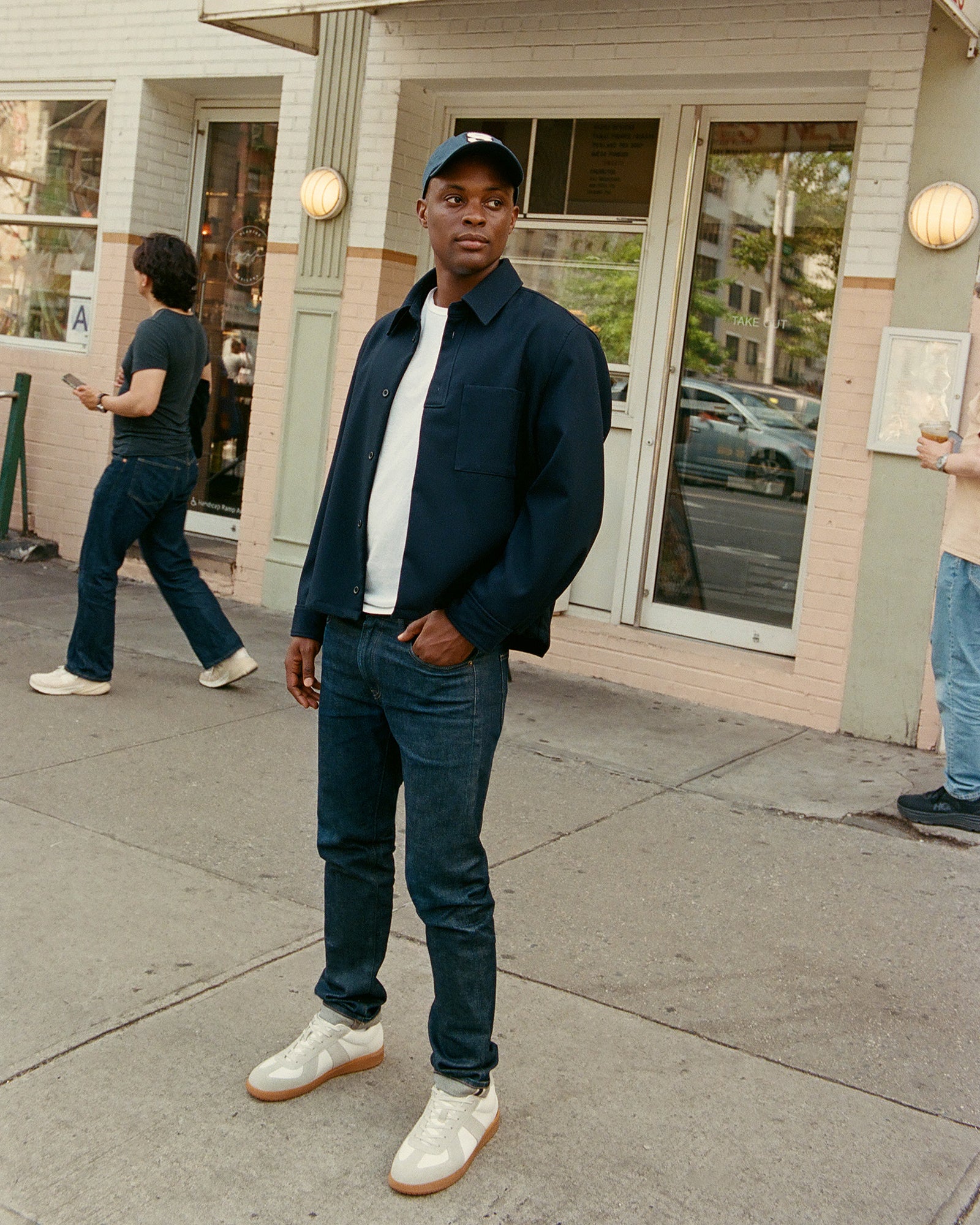 Side view of DIXON low-top sneakers showing suede and leather details