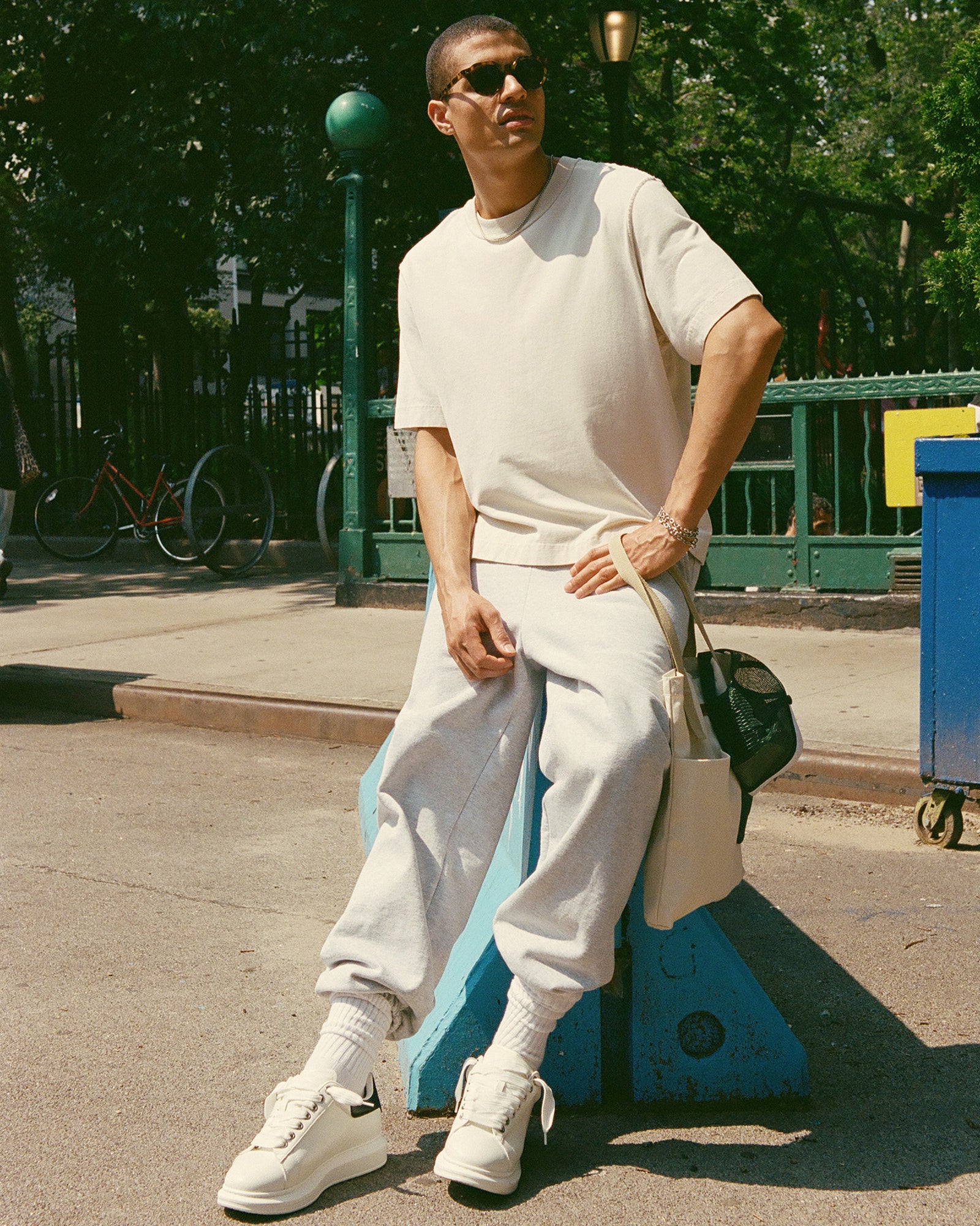 Street-style outfit featuring Frosted Flex white platform sneakers in an urban setting