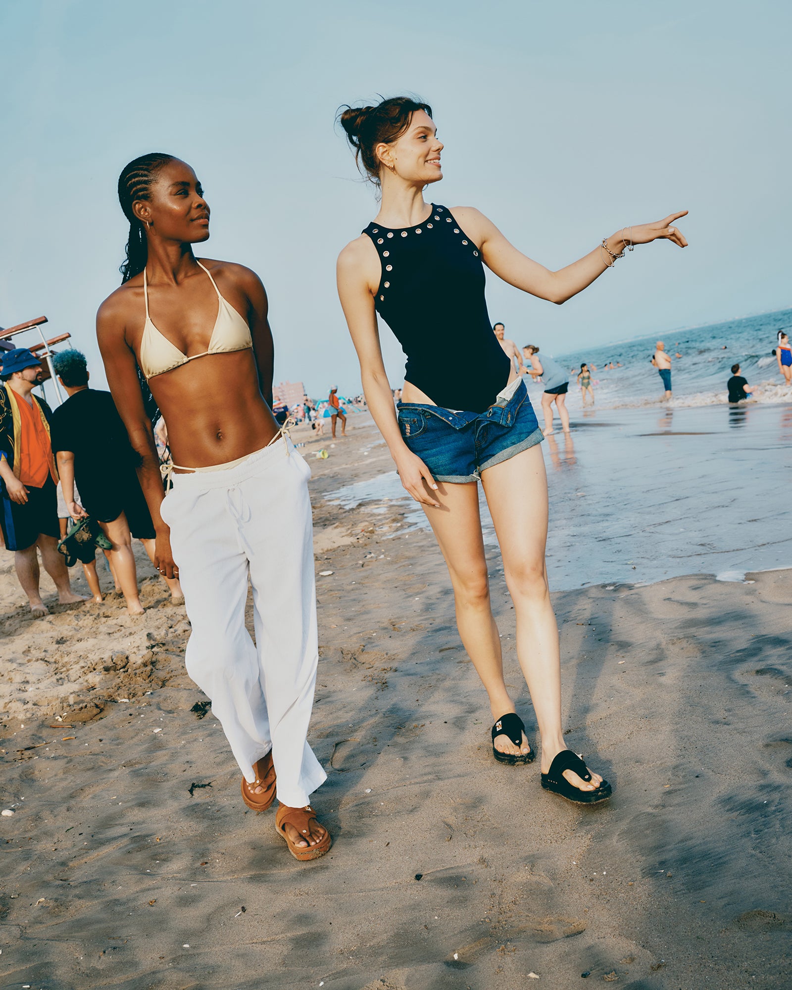 Nico black bodysuit worn with high-waisted trousers for a polished look.