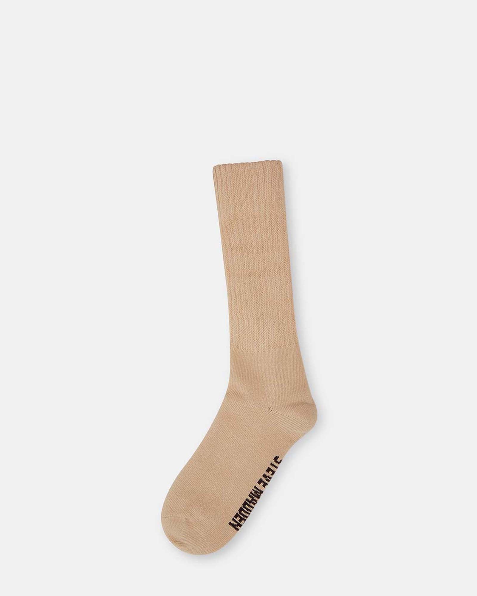 Close-up of tan slouchy scrunch sock with ribbed texture for everyday wear