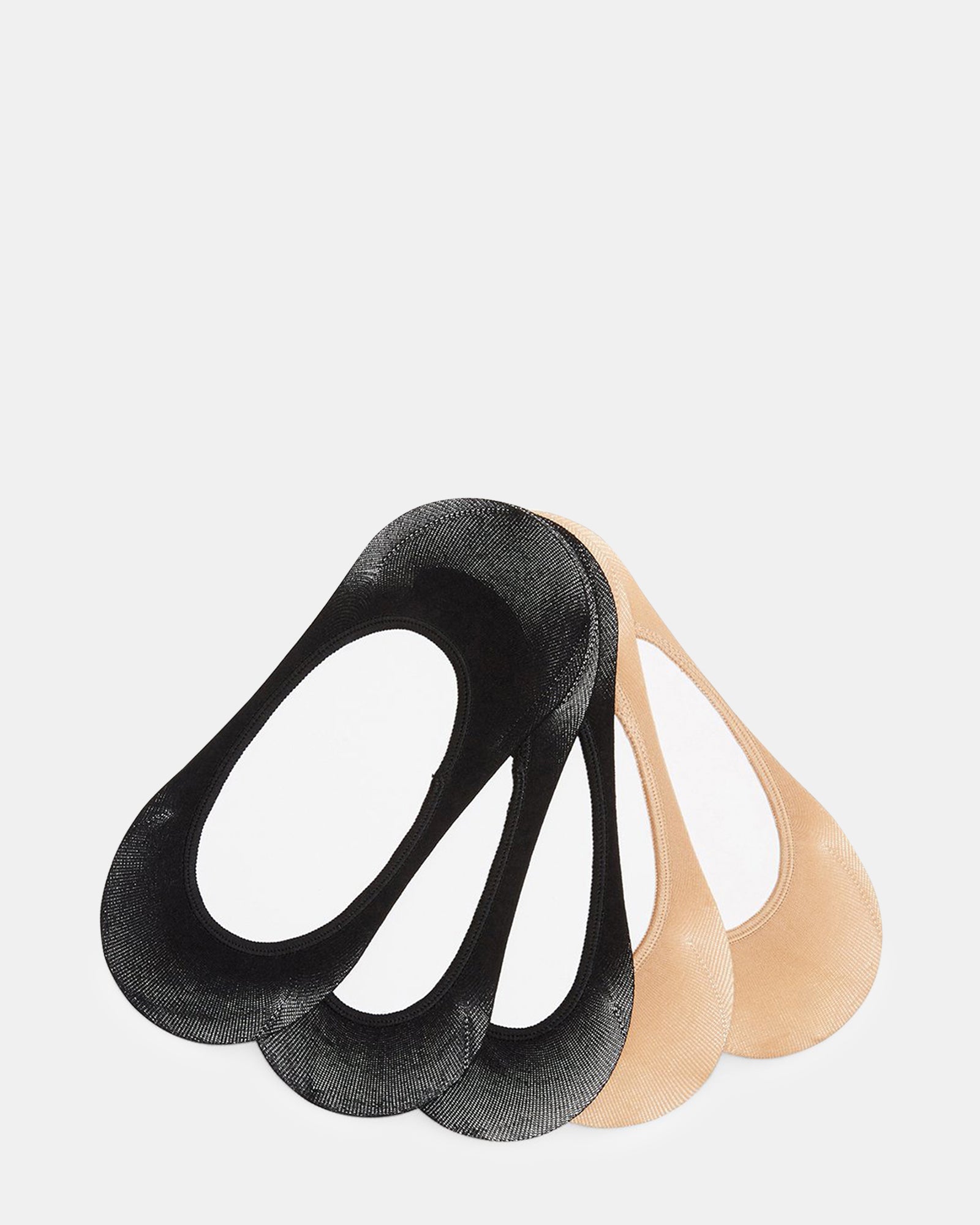 Close-up of bombas no show socks in black and tan on a flat shoe.