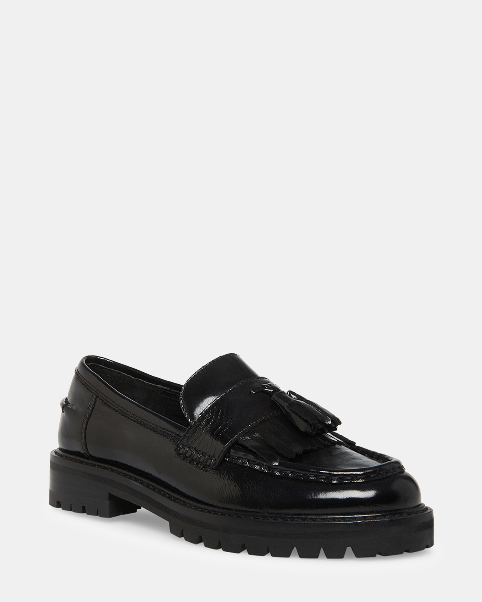 Close-up of MINKA loafers tassel detail and textured sole