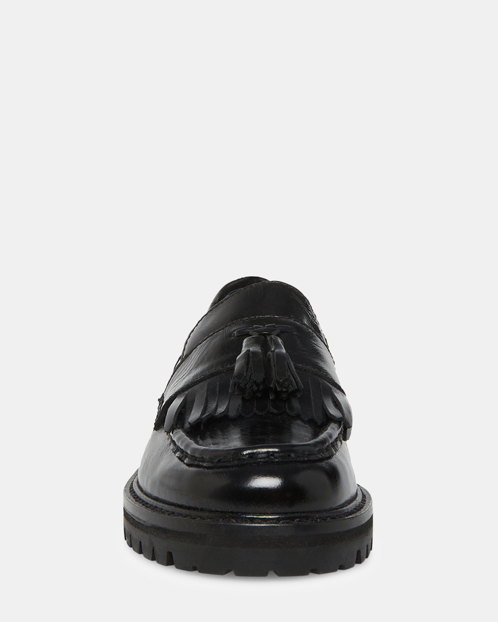Mens black leather loafers paired with dark denim