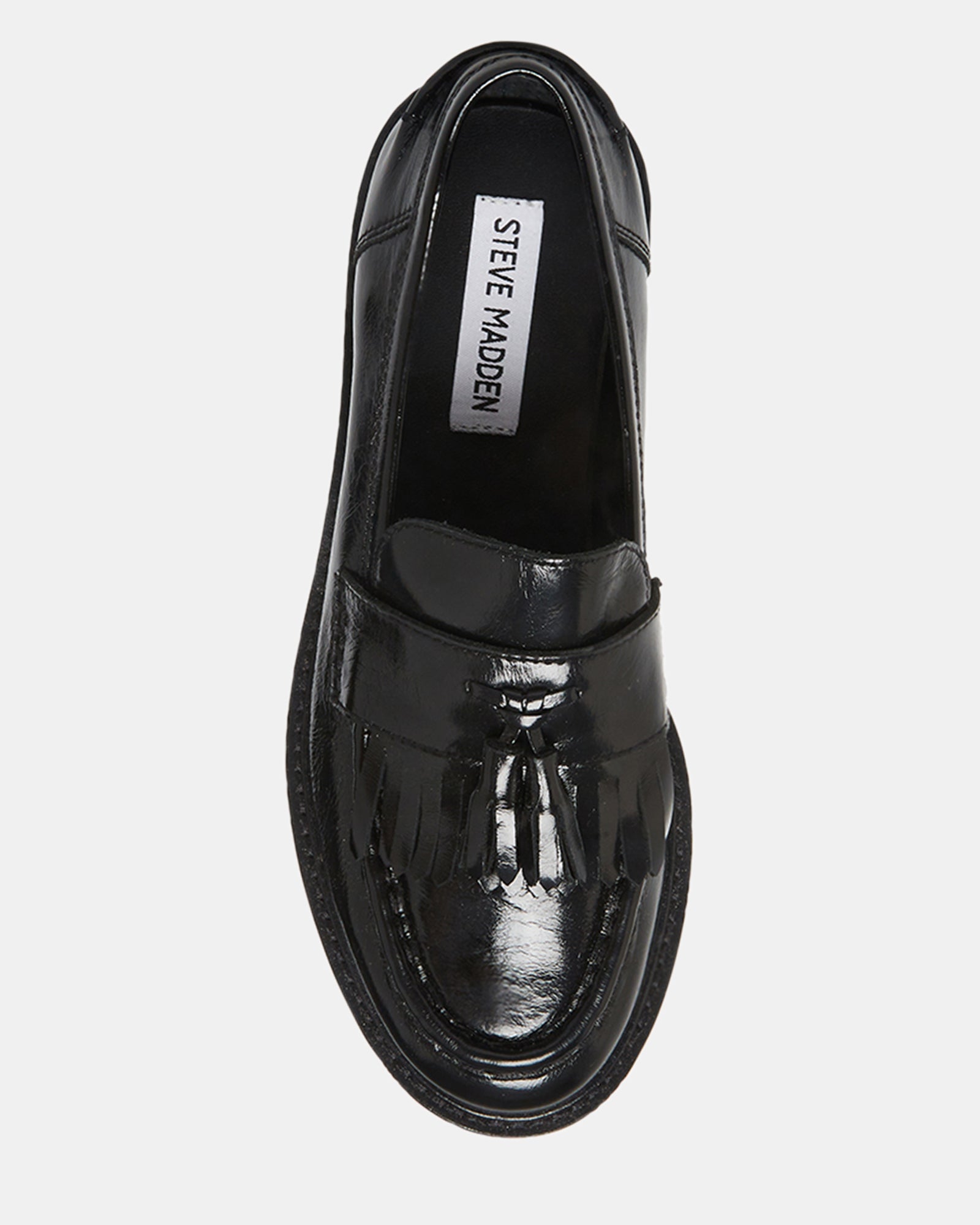 Womens black leather slip-on loafers styled with cropped trousers