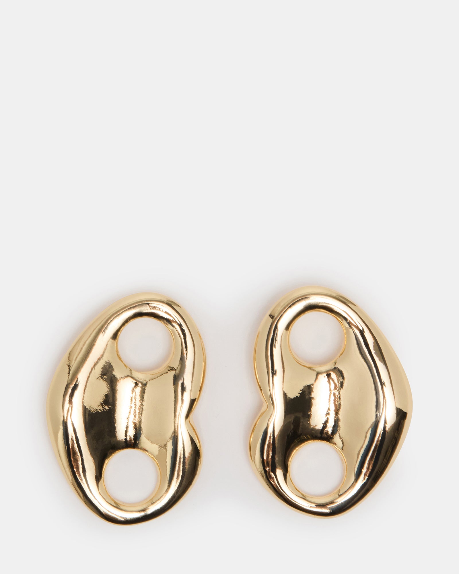 Close-up of mariner earrings with cubic zirconia on a neutral background