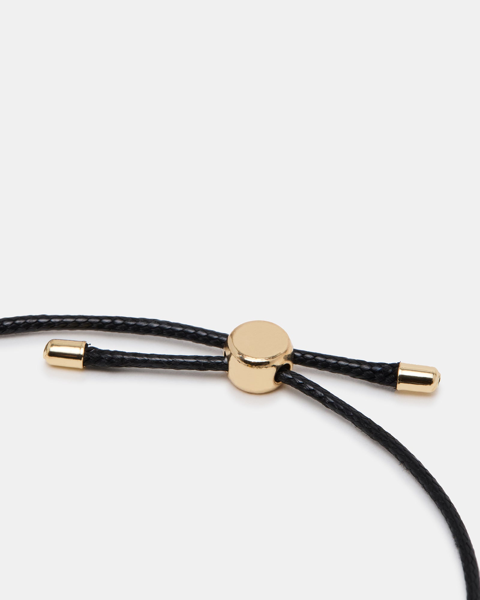 Stylish black bracelet worn with a casual outfit.