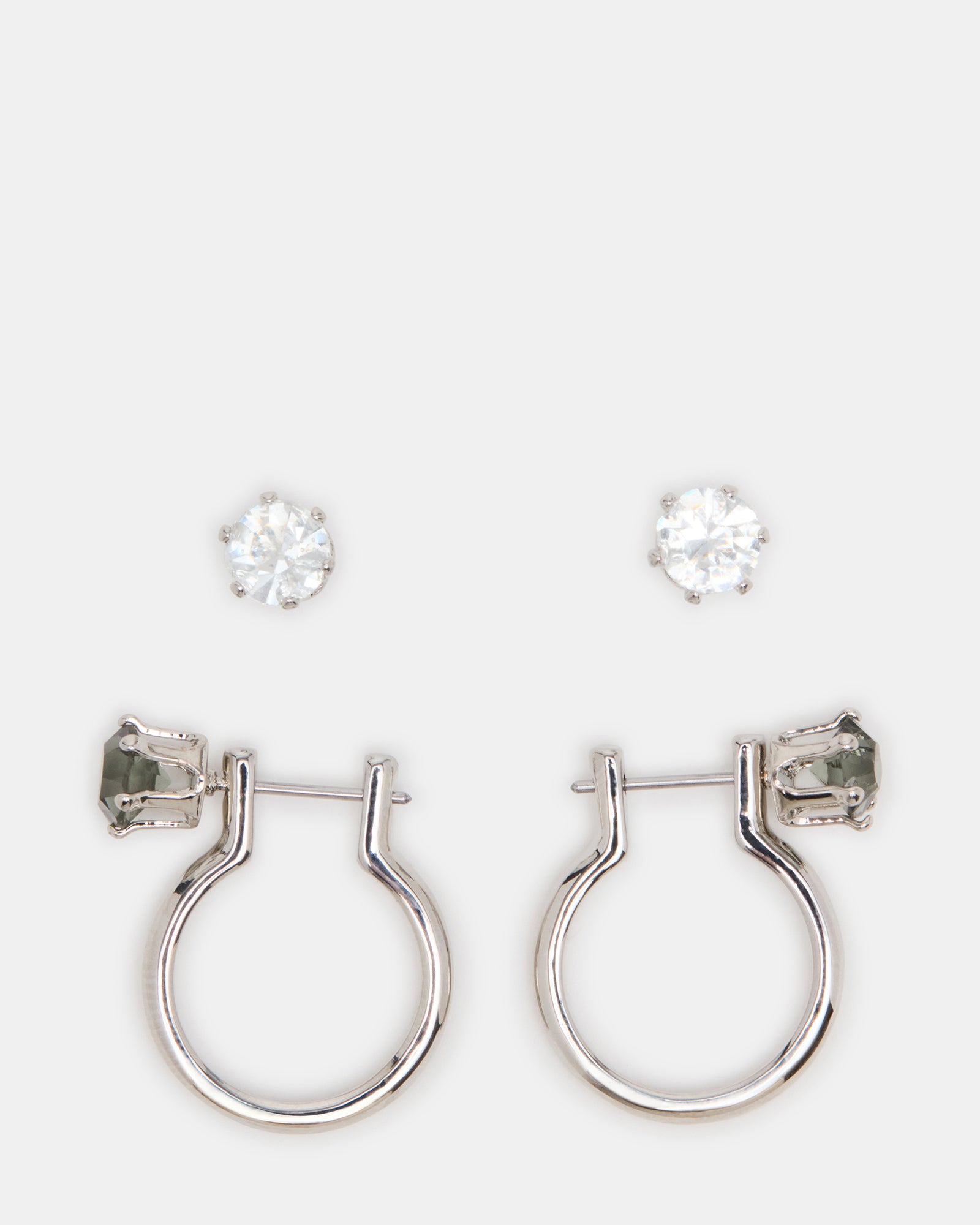 Elegant crystal drop earrings with black and silver accents on a model