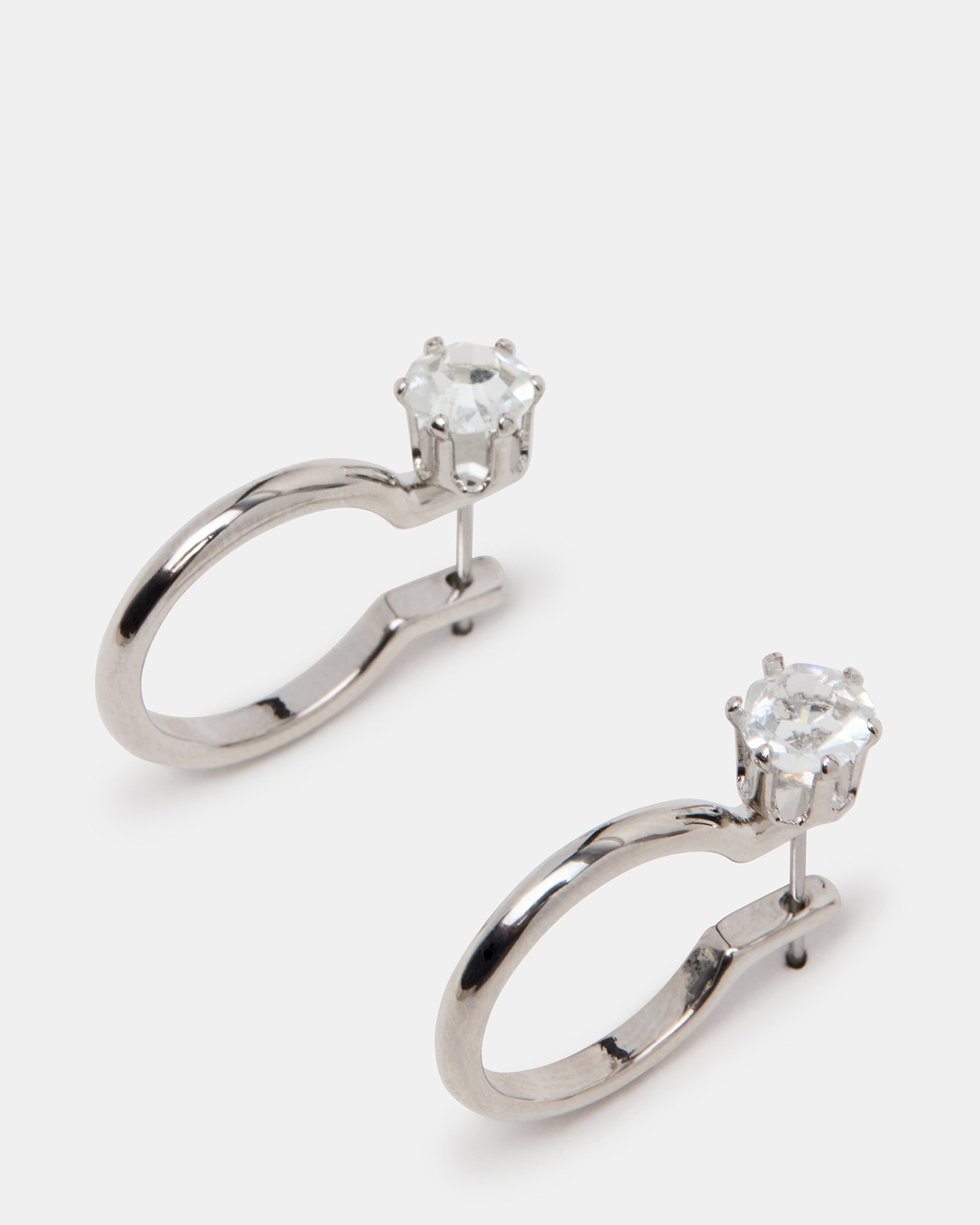 Fashionable black silver earrings styled with evening wear