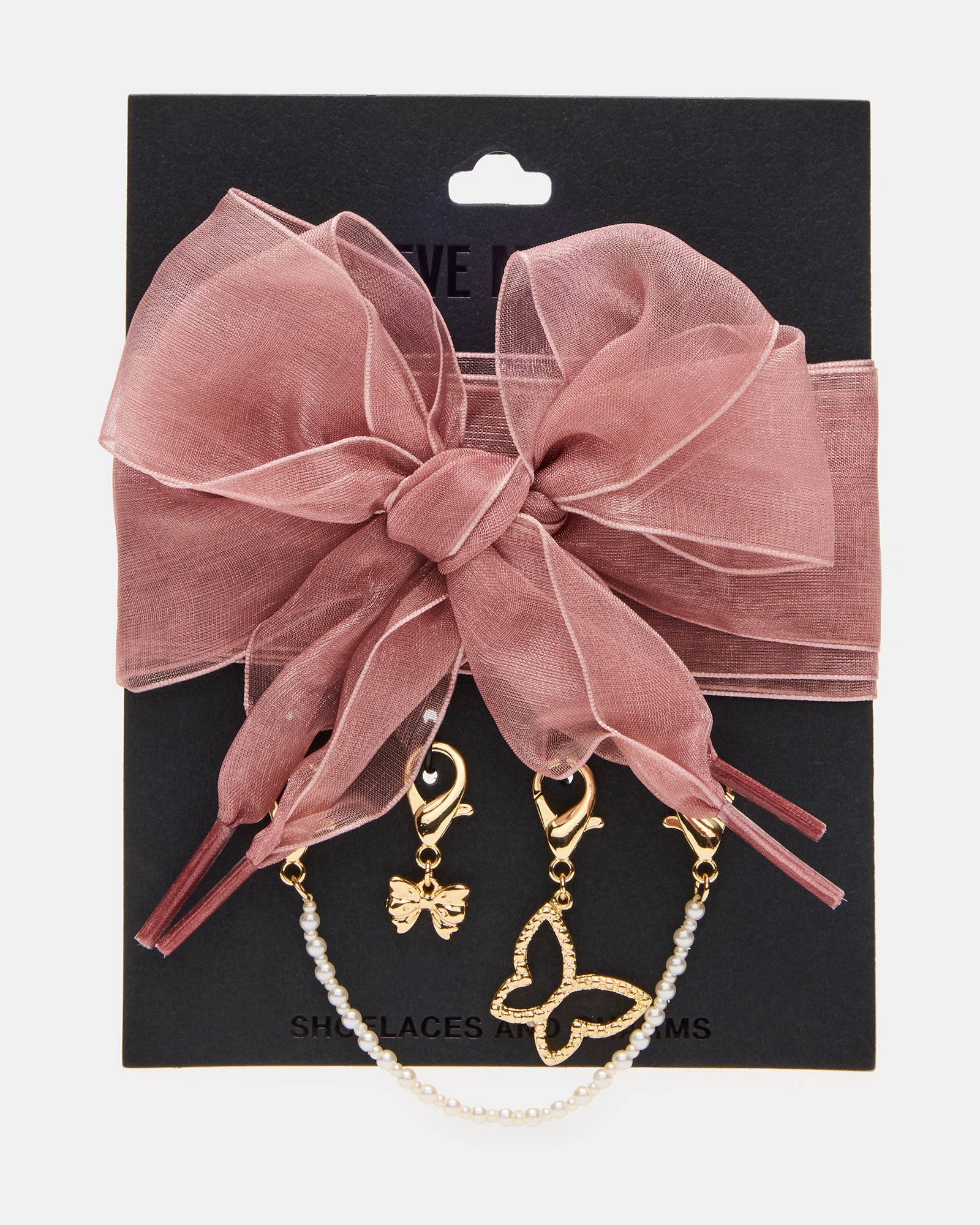 Close-up of shoe charm detail showing butterfly design and rhinestone sparkle
