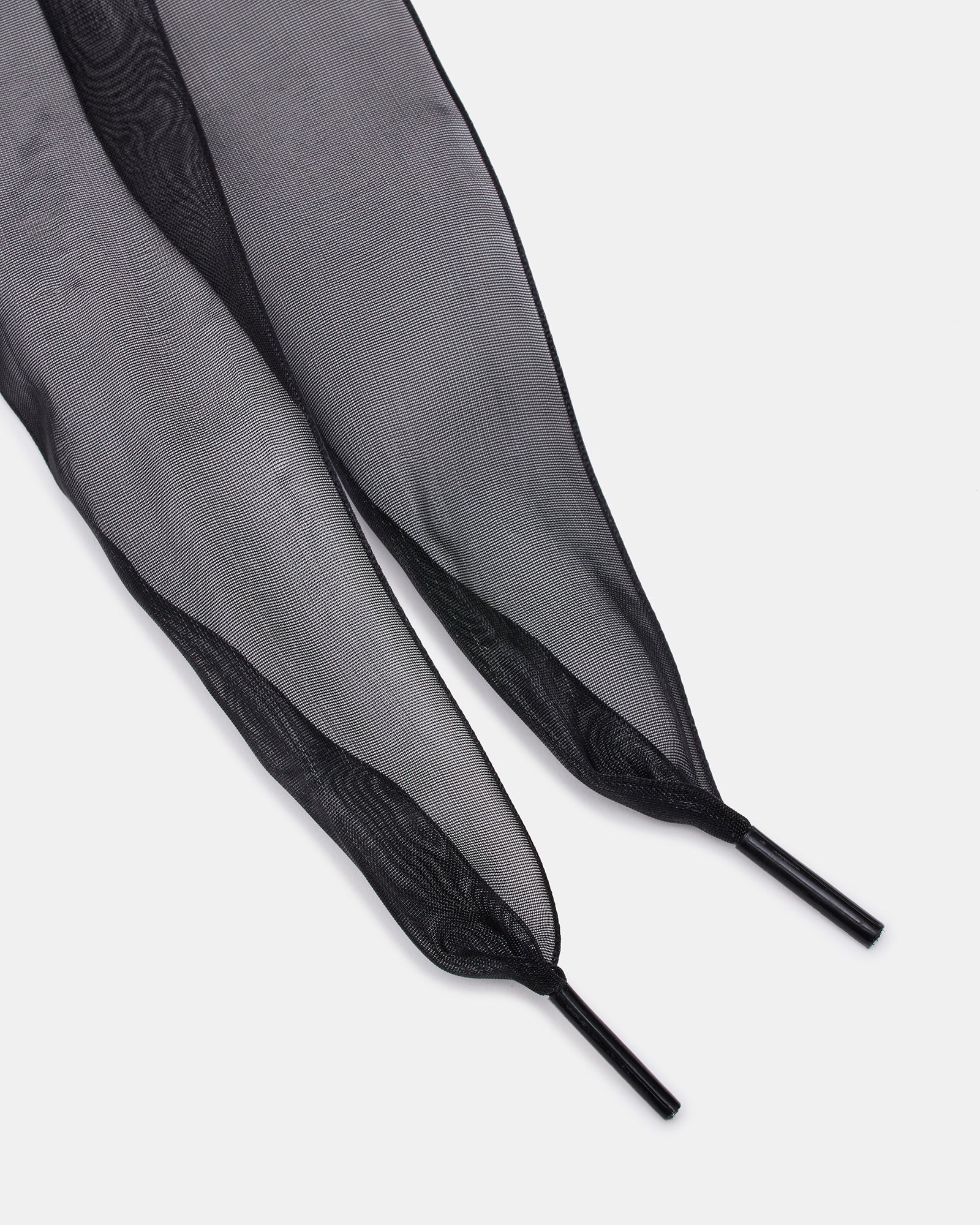 Black lace bow detail on fashionable high heel shoes.