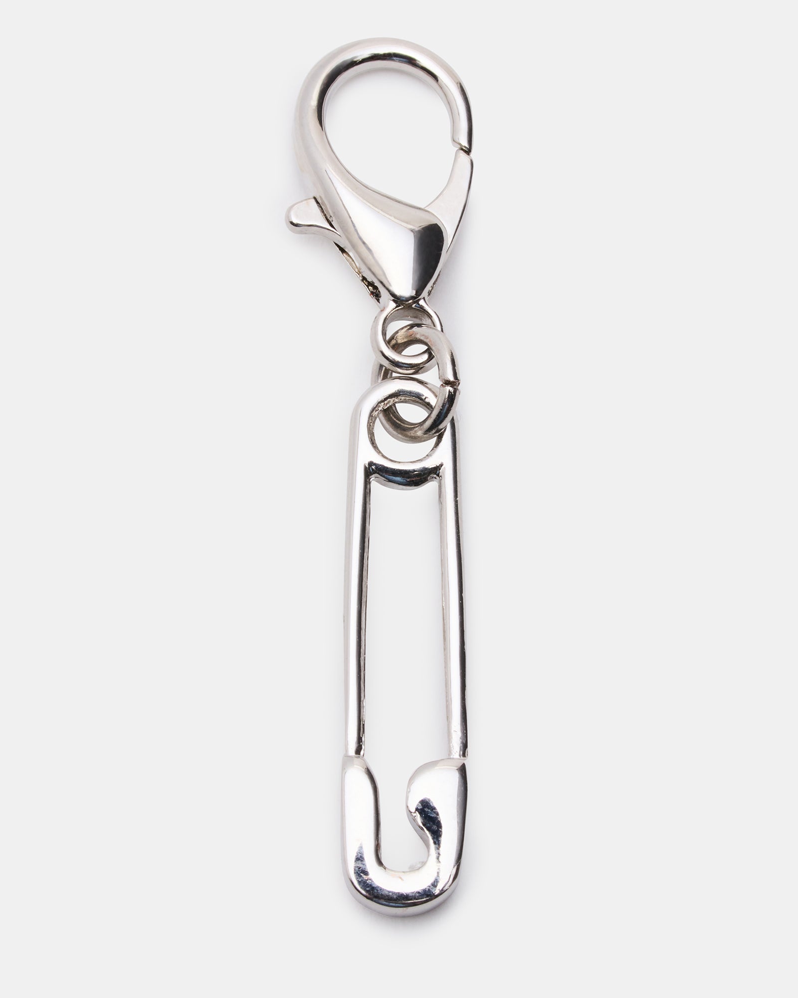Close-up of black shoe charms featuring a pearl and rhinestones.