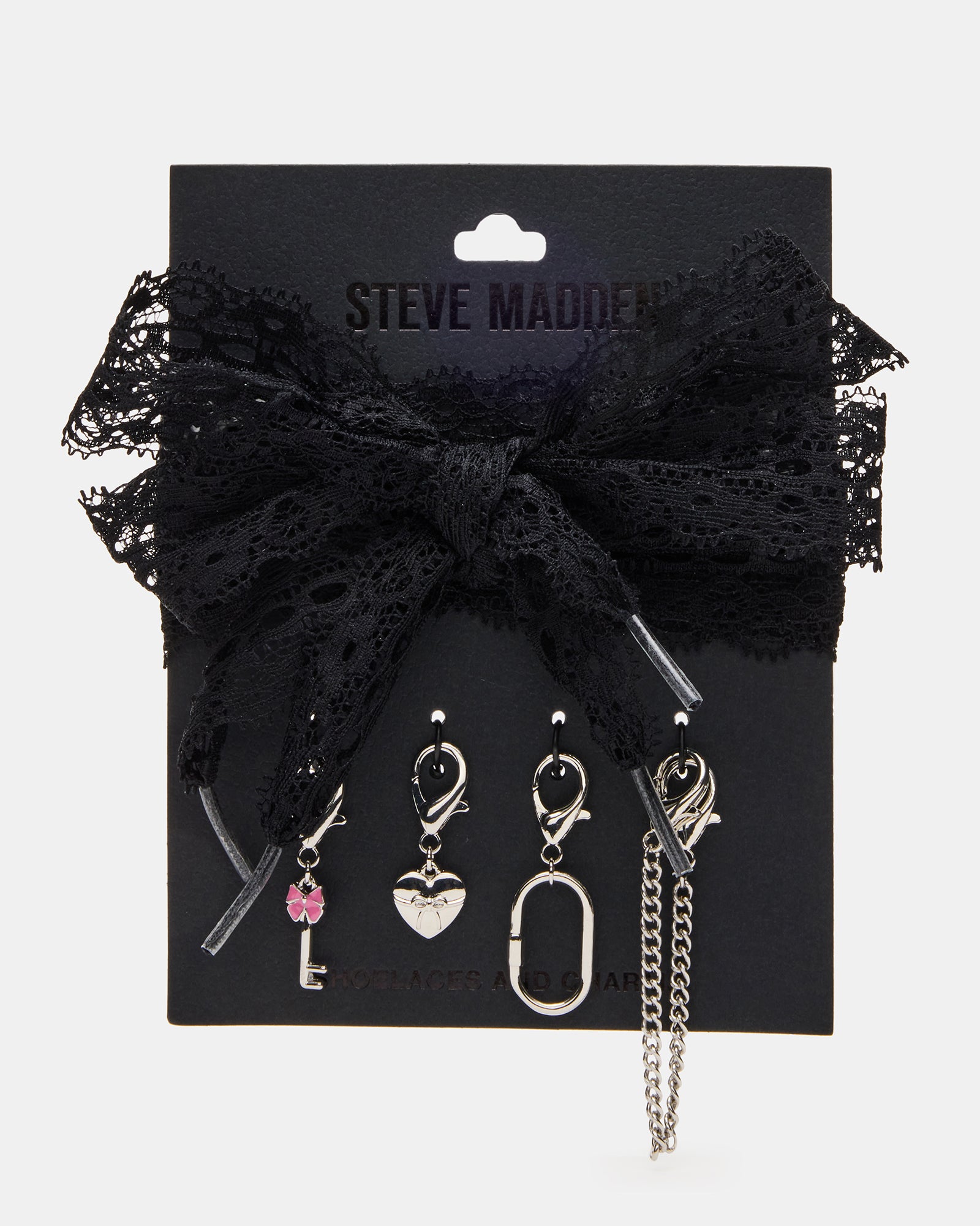 Close-up of black shoe laces adorned with decorative charms.