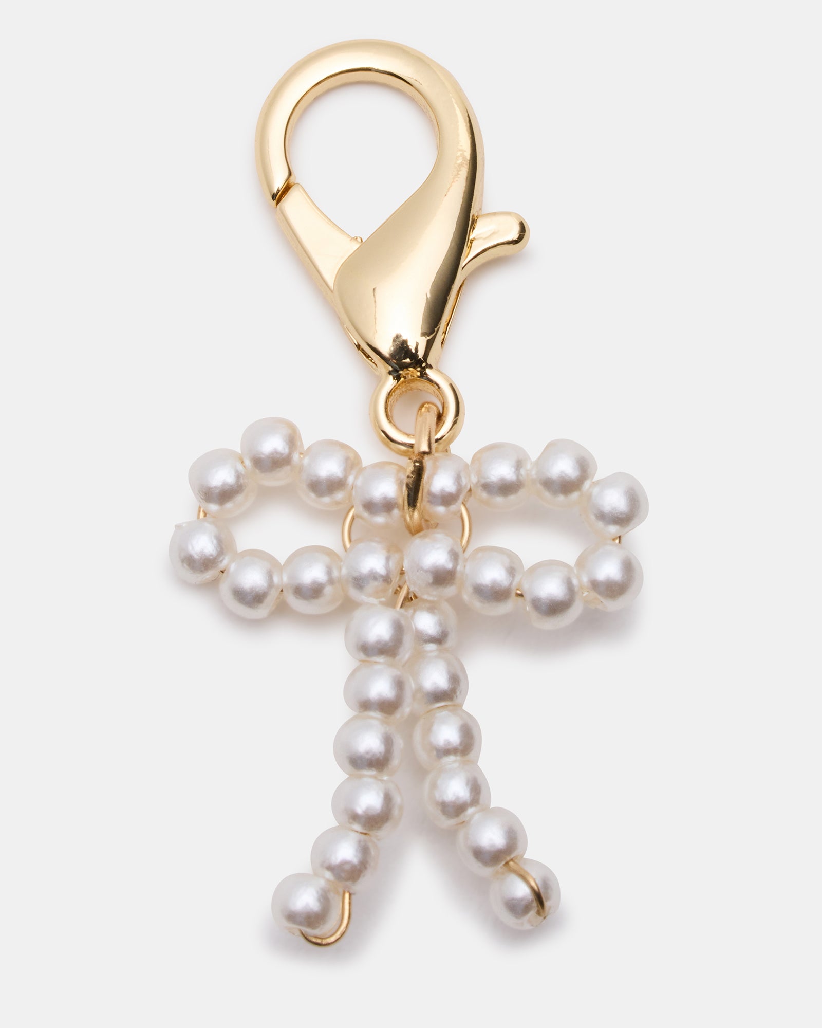 Fashionable shoe charms on white laces giving a unique touch.