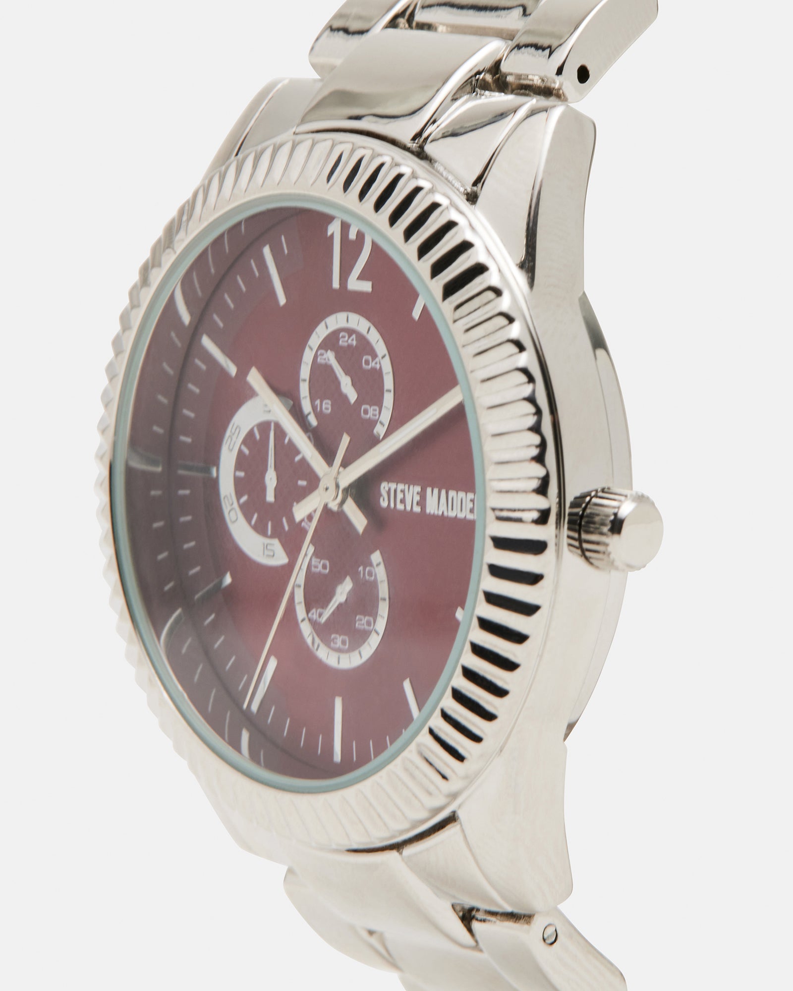 Side angle of silver watch showing metal link band on wrist