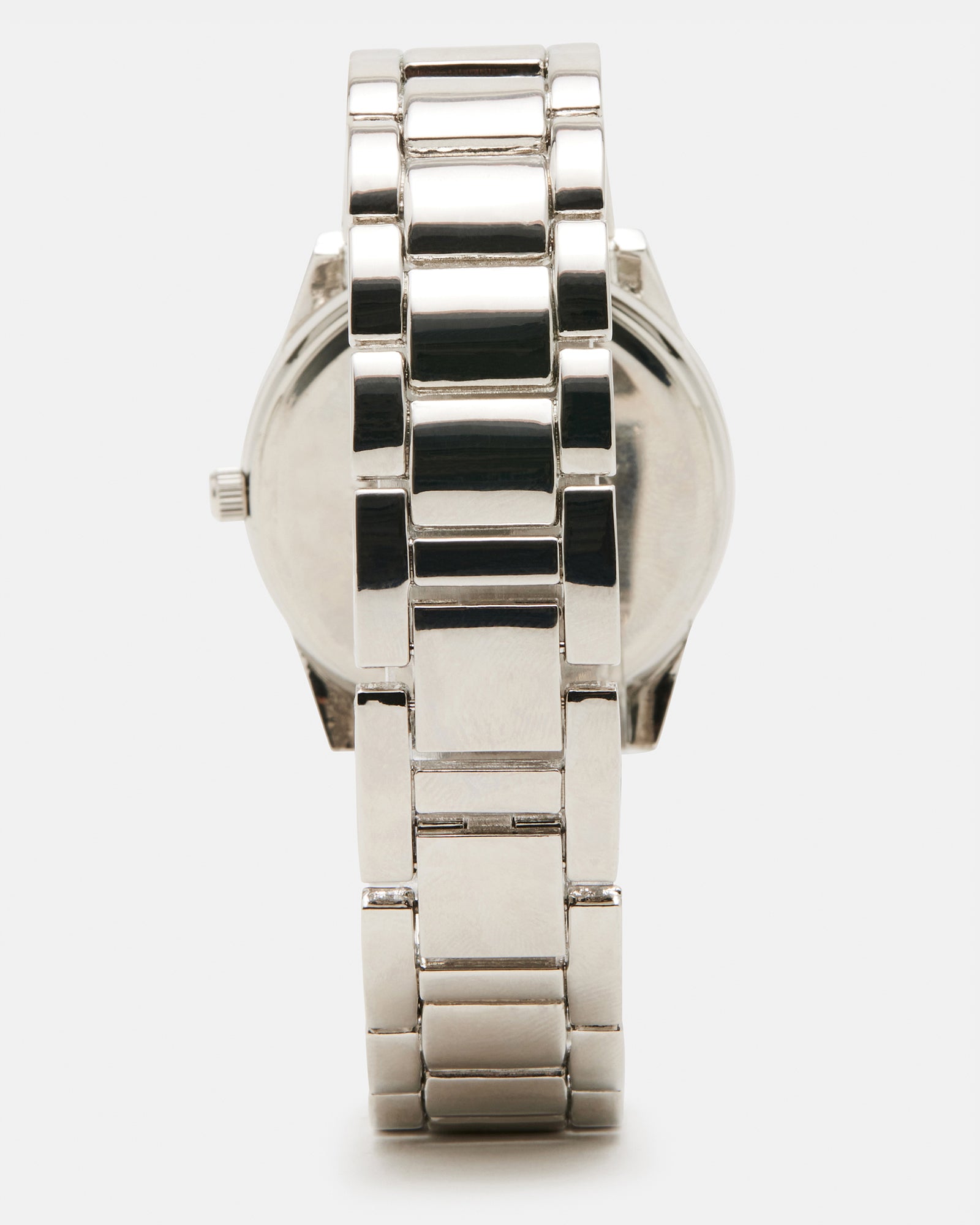 Lifestyle shot with silver watches for women worn with minimalist jewelry