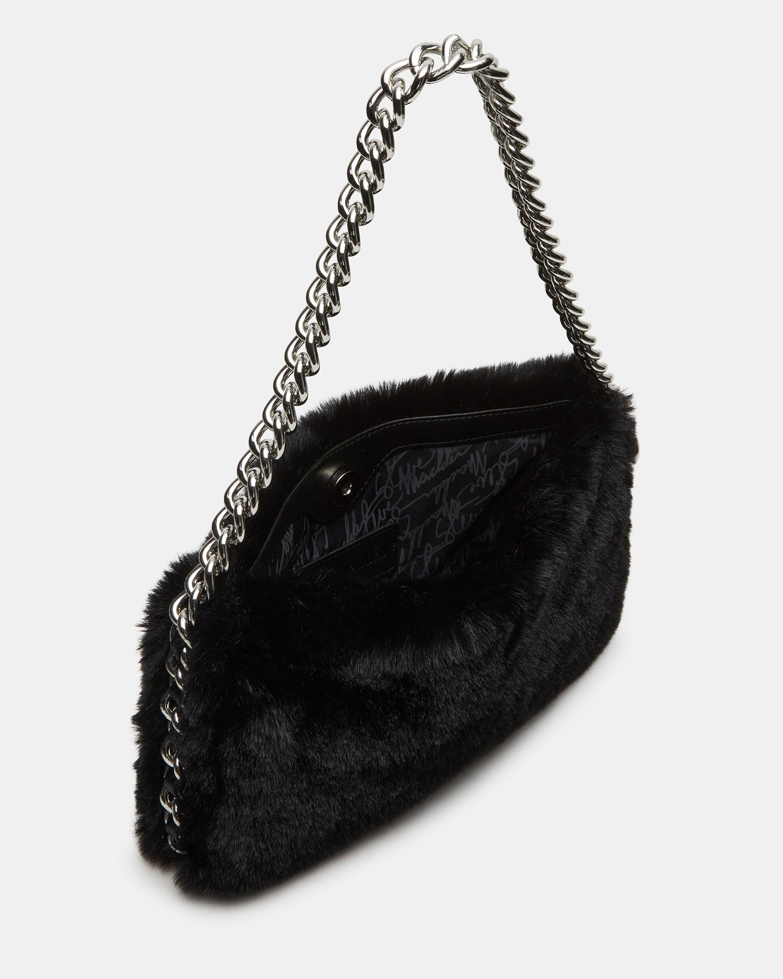 Close-up of the fuzzy shoulder bag highlighting the chain strap and magnetic snap closure.