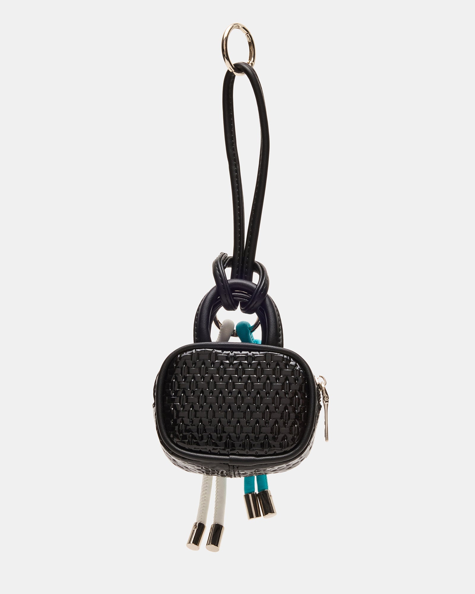 Close-up of designer bag charm with tubular embellishments and O-ring clasp