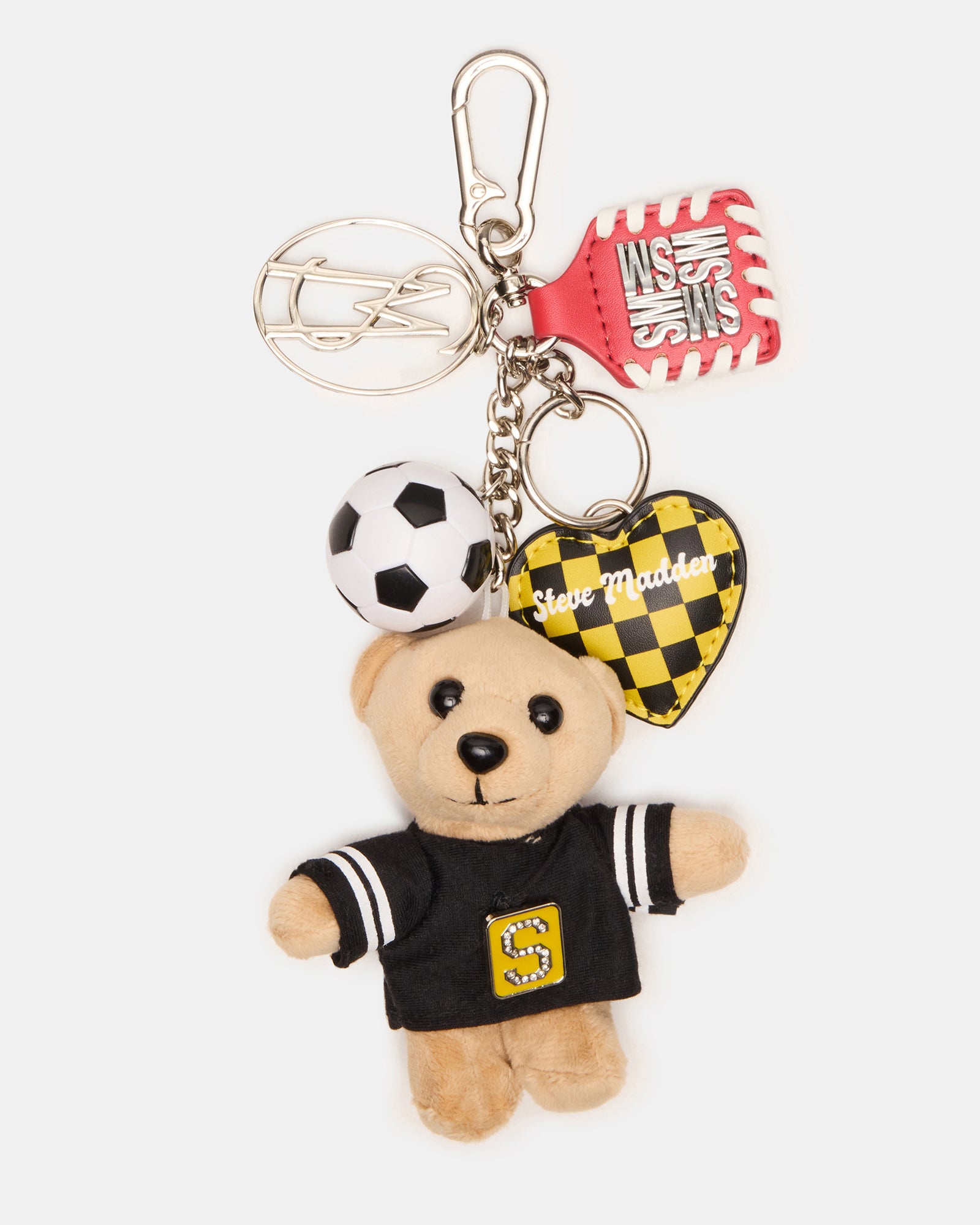 Close-up of the soccer bear bag charm with a heart charm.