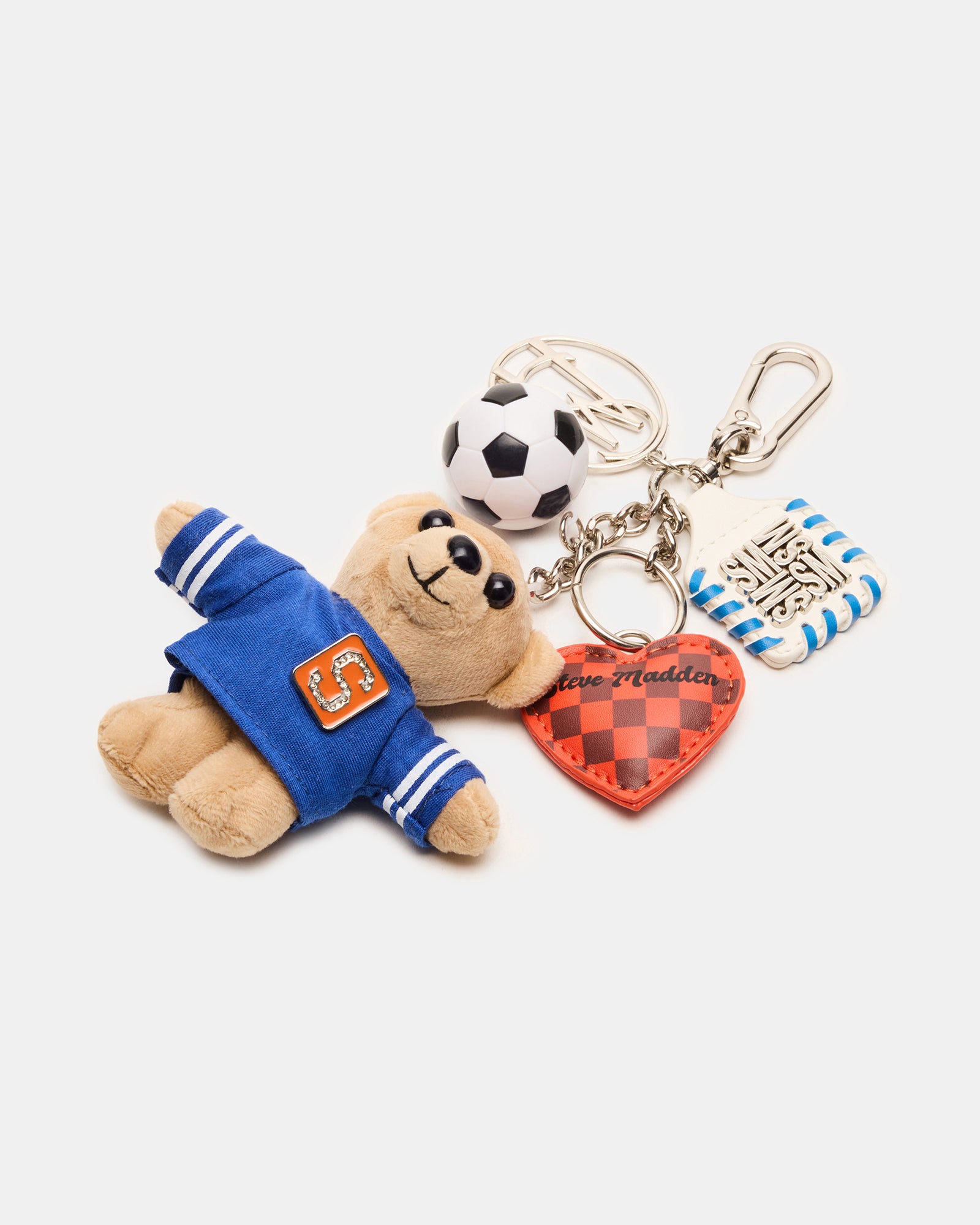 Front view of soccer bag charm on navy tote with puffed heart detail