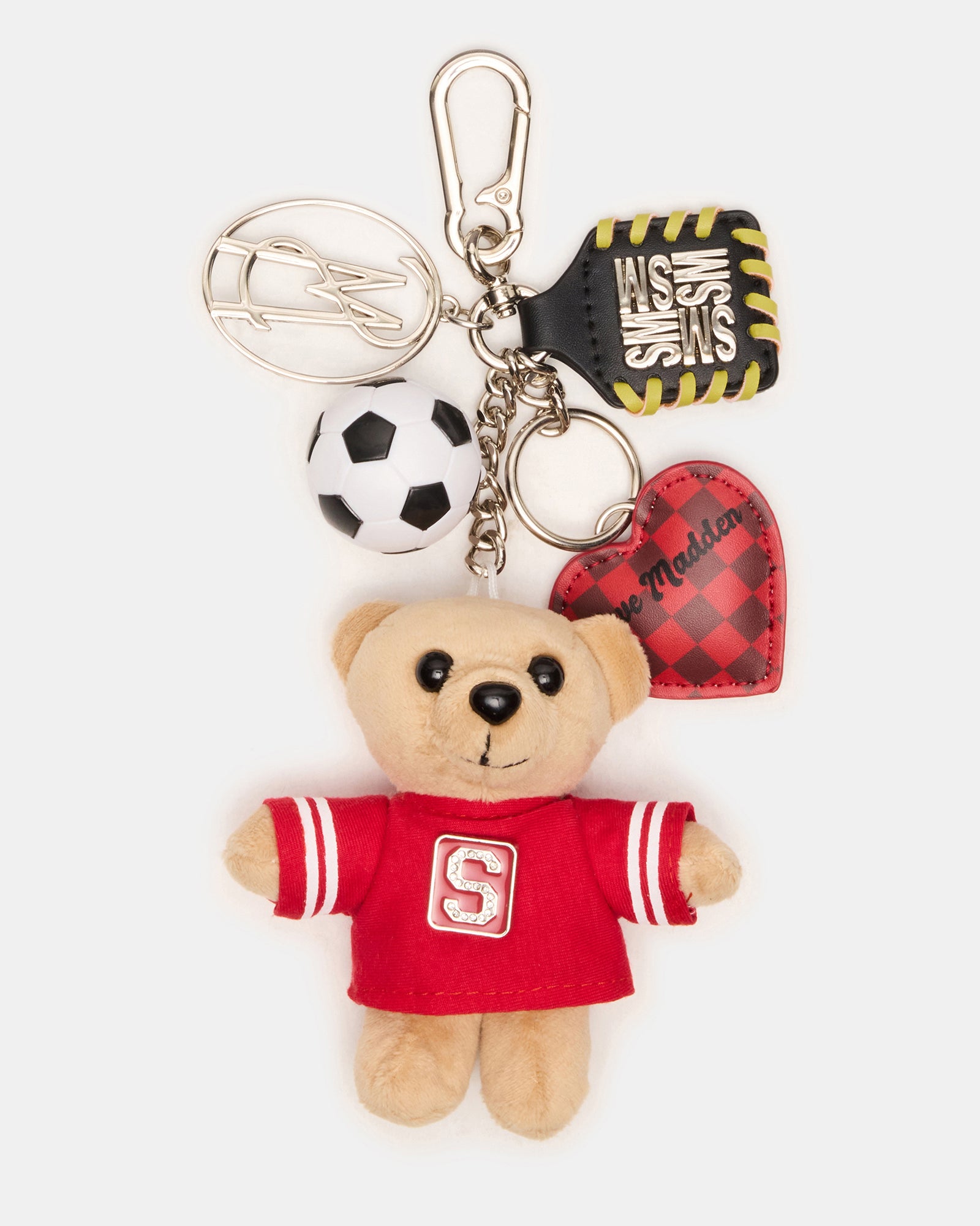 Close-up of the plush bear and soccer ball charm on a handbag