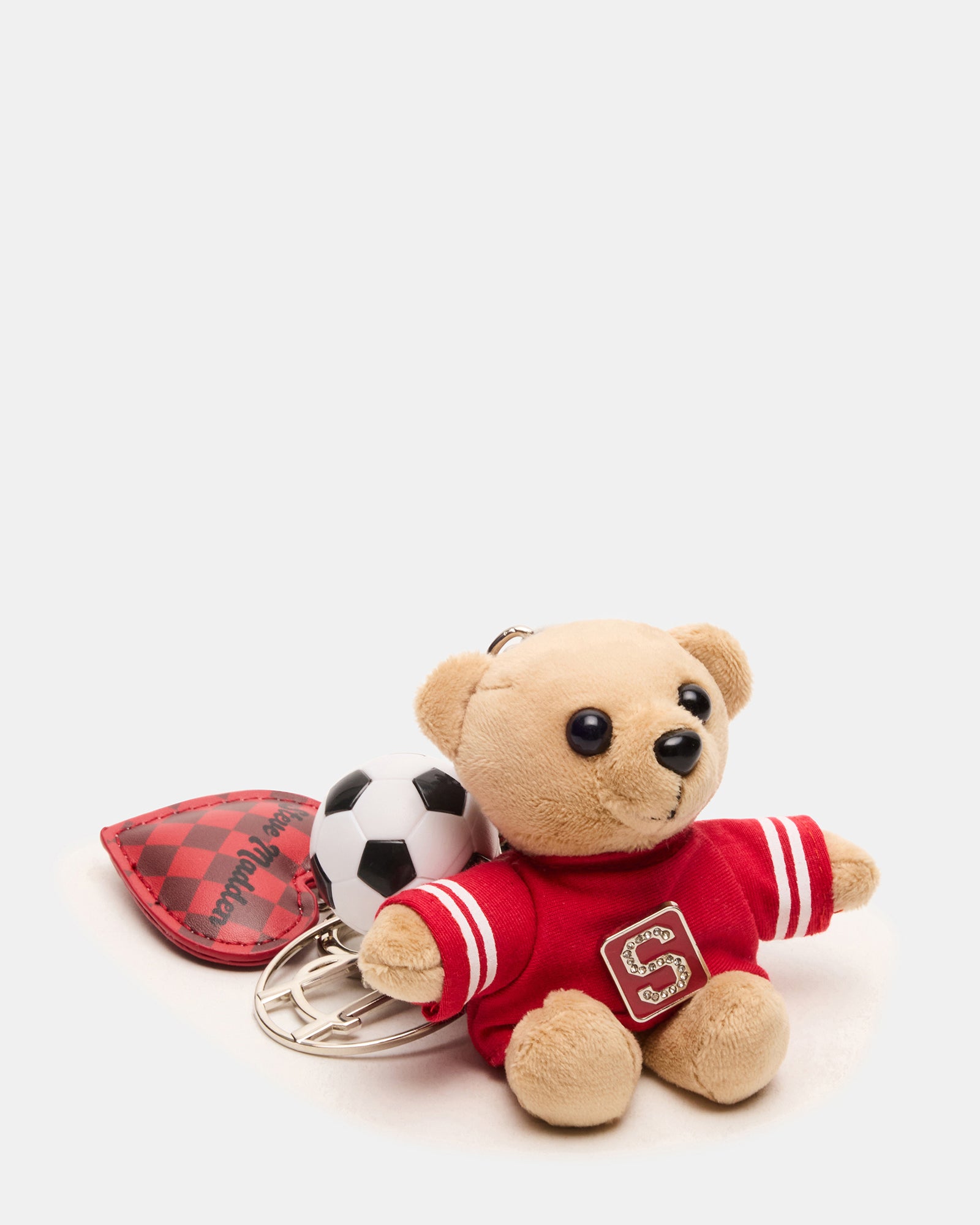 Colorful bag charm featuring puffed heart and metal logo details