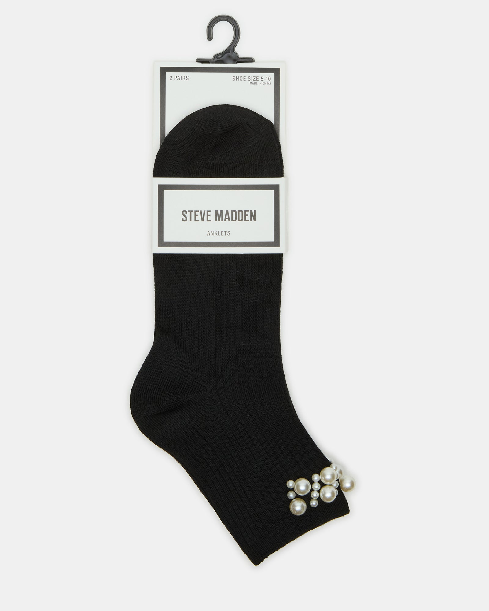 Womens anklet socks folded beside travel essentials for weekend trips