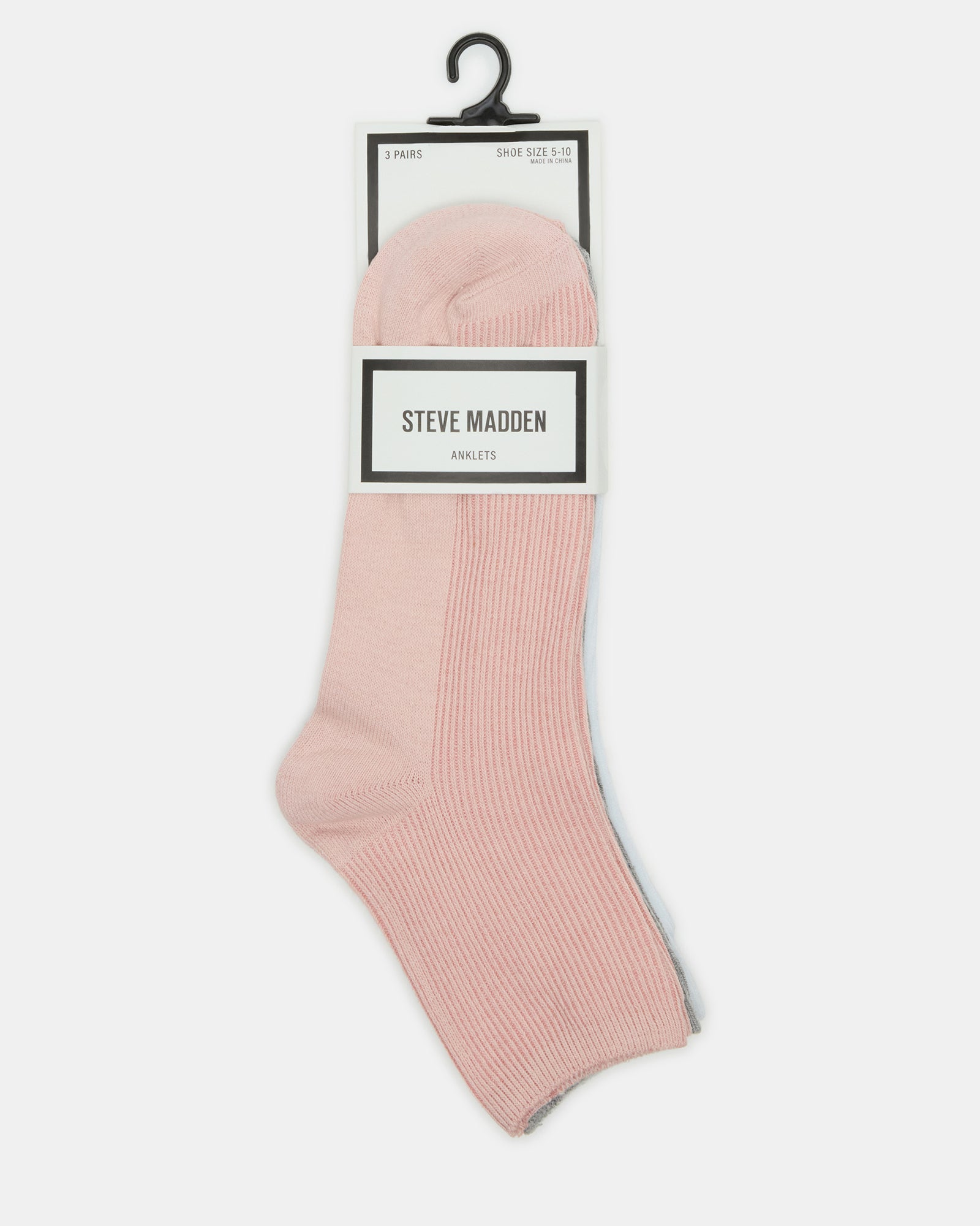 Flat-lay of 3 pack anklet socks on a wooden tray with lifestyle accessories