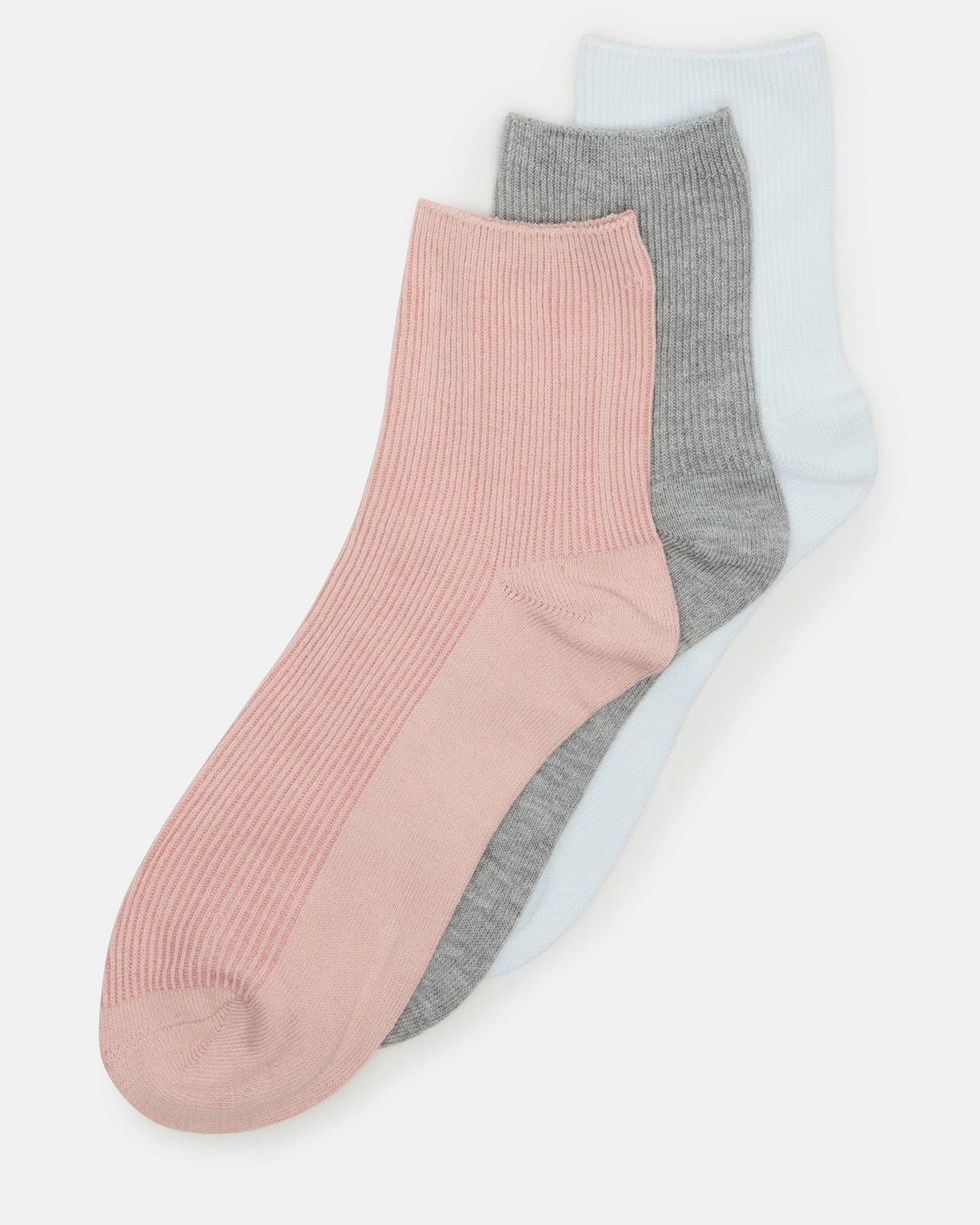 Blush anklet sock laying folded beside casual sneakers