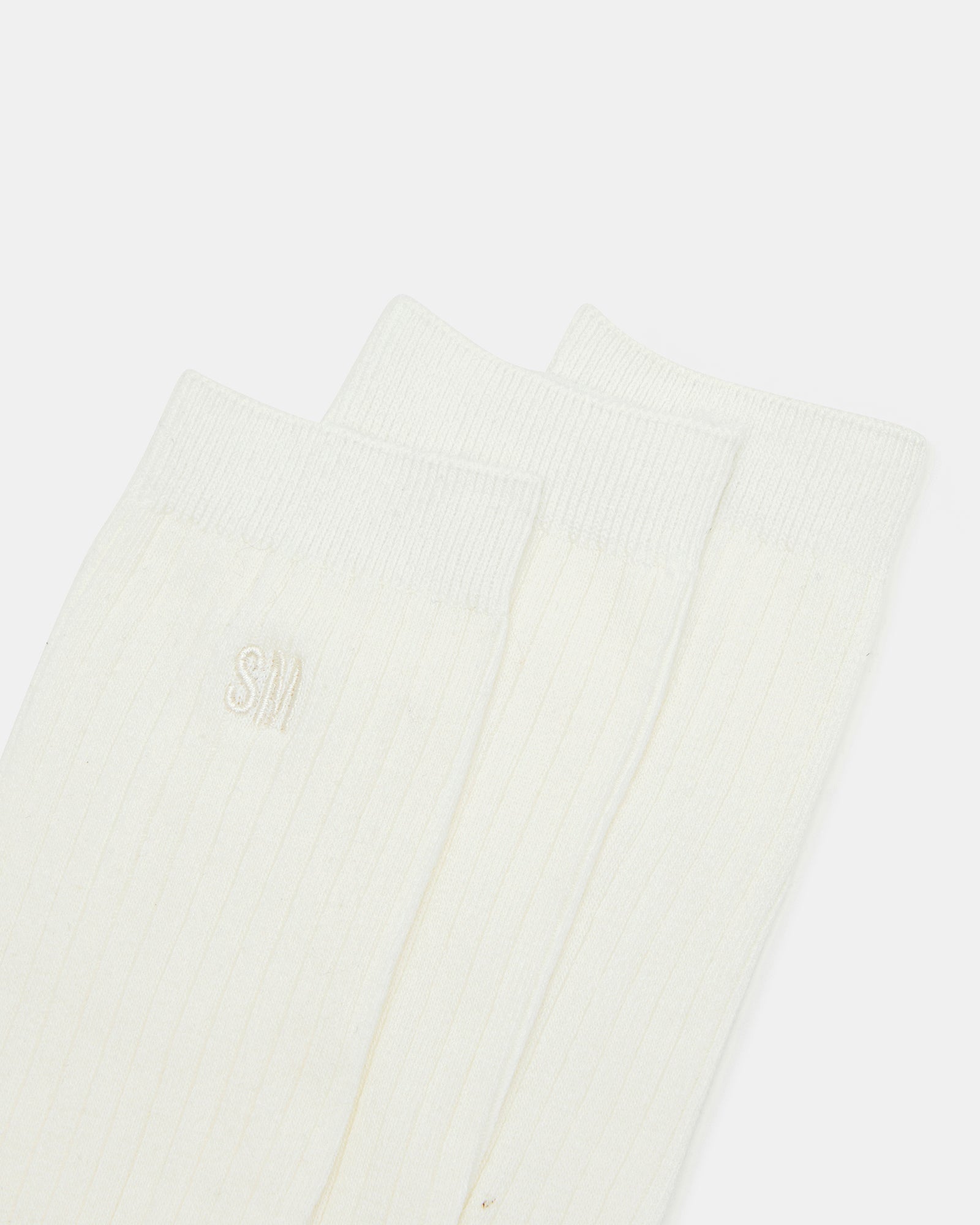 Close-up of Wilderr suede slides showing the soft footbed.