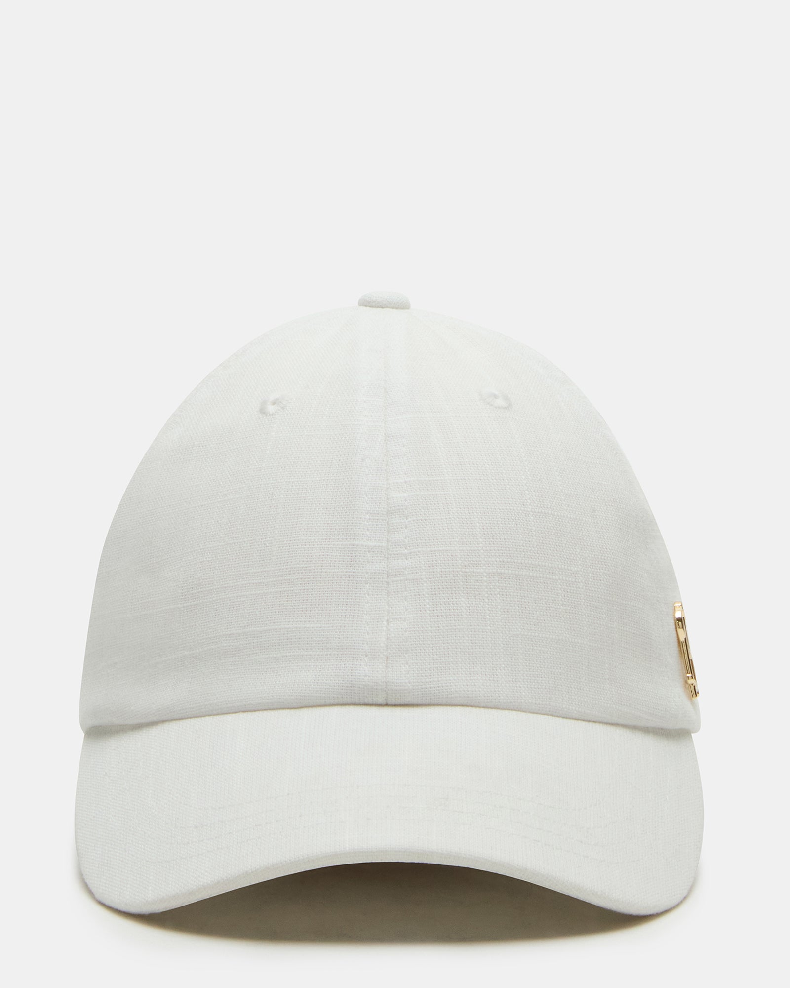 Close-up of cream linen baseball cap showing adjustable strap